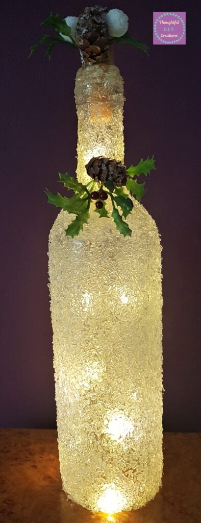 The Bottle with the lights turned on during the day.