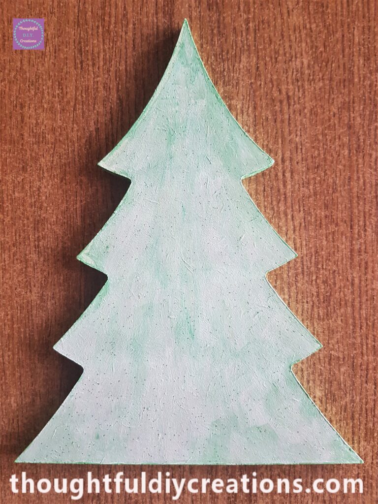 I painted the first layer of the mousse onto the christmas tree using a small flat paintbrush.