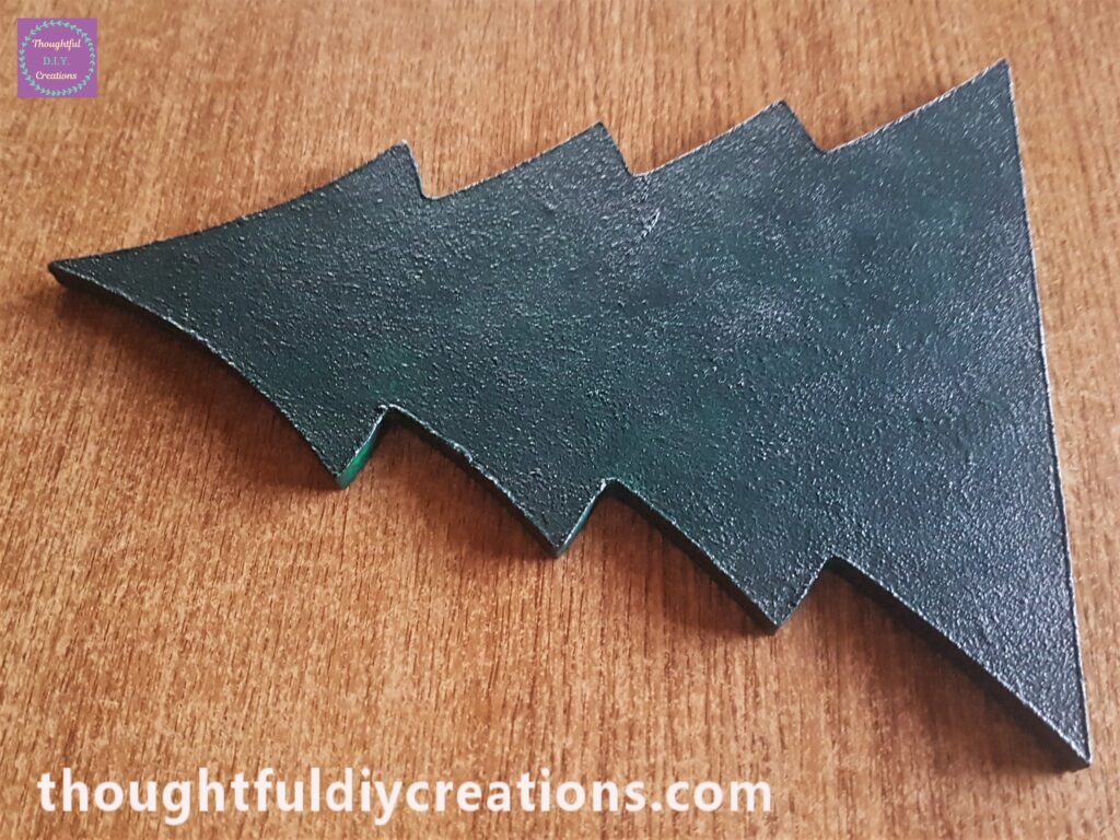 3 layers of the green paint on the tree with the sponge, it gave a textured effect.