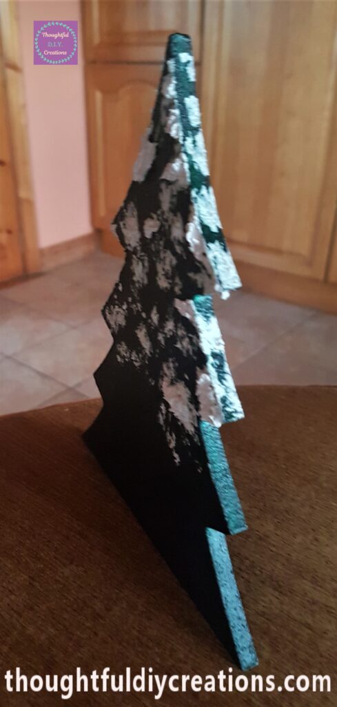 More snow paste added to the mid-section of the tree.