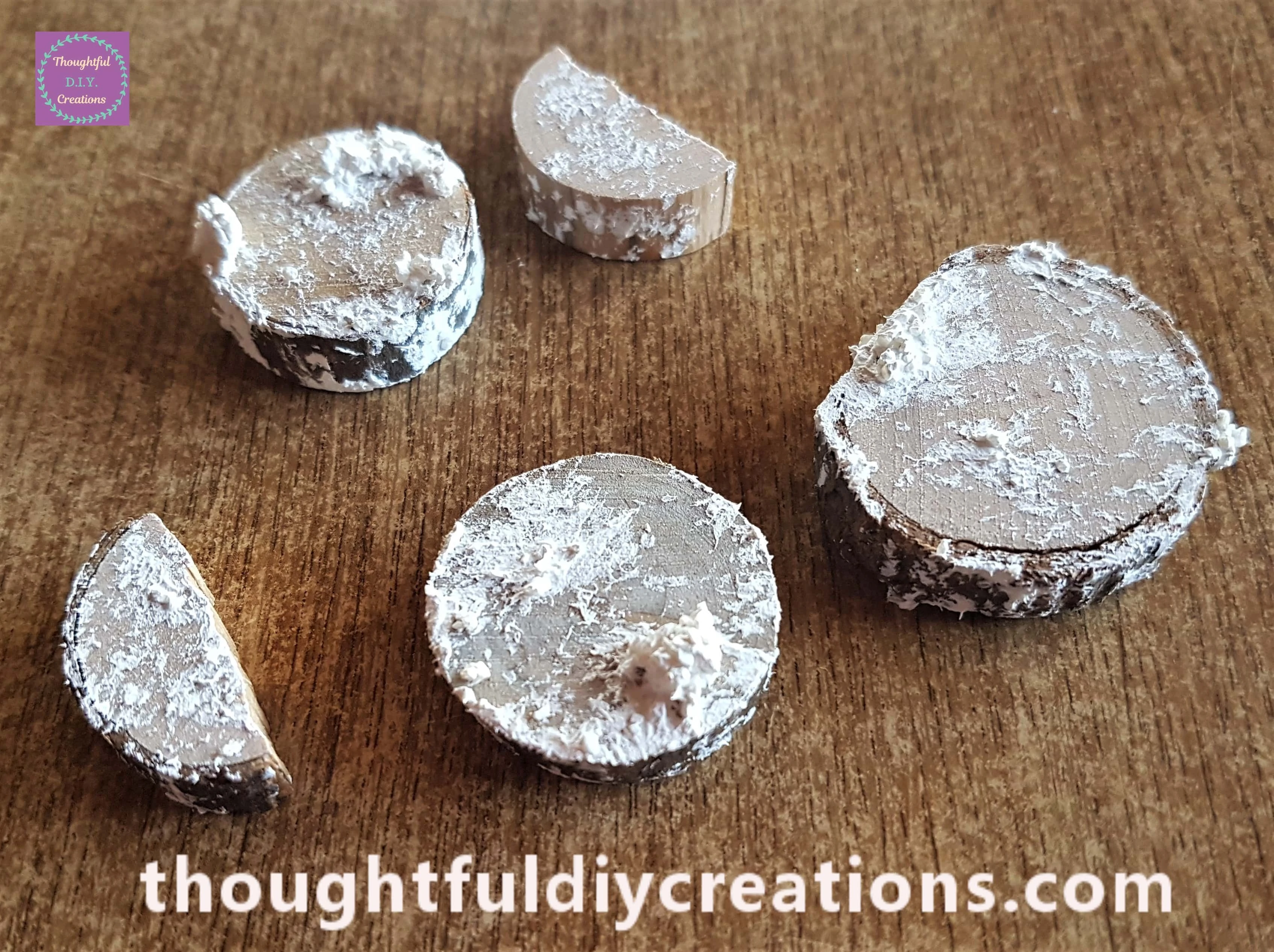 Snow paste on a few wood slices.