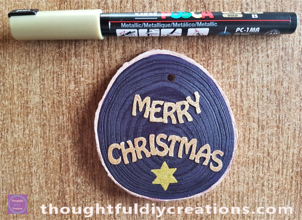 I drew and coloured a star under the sticker with a gold paint pen.