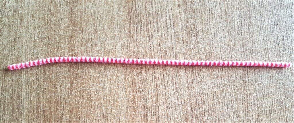 Red and White Pipe Cleaner from a Christmas Set.