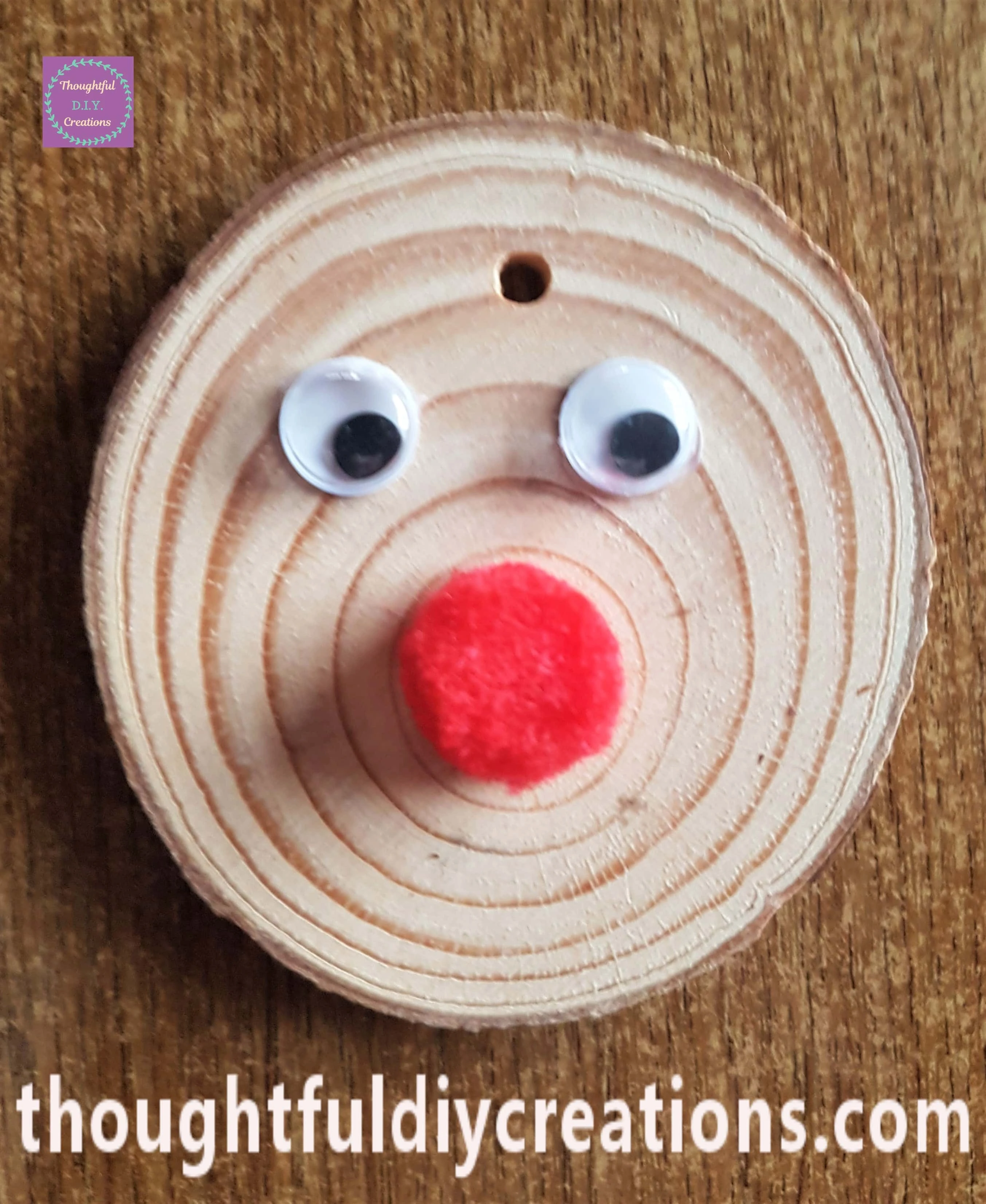 Pair of Eyes and a Red Pom Pom on the Wood Slice with my Hot Glue Gun.