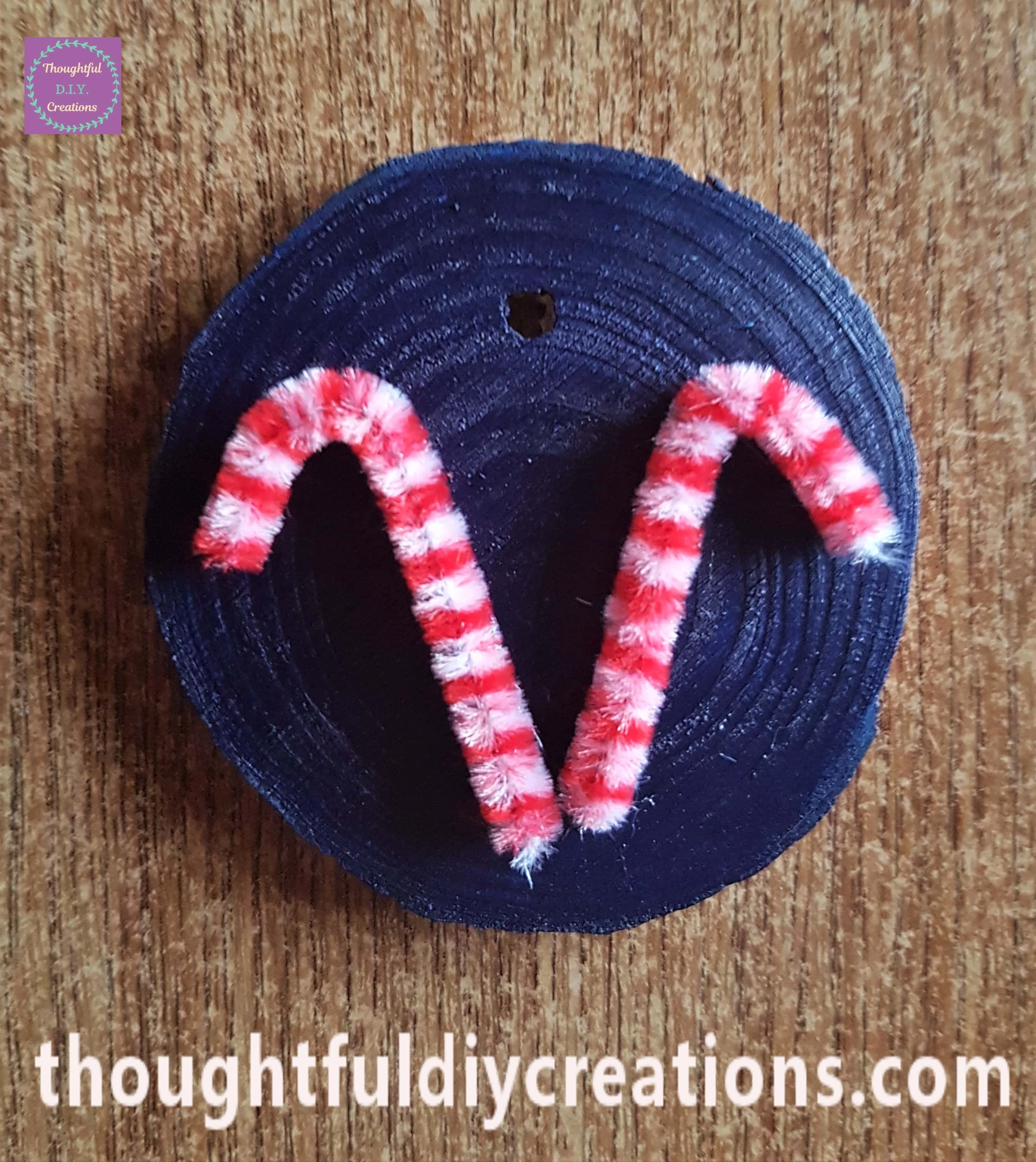 I attached them to the blue wood slice with my hot glue gun.