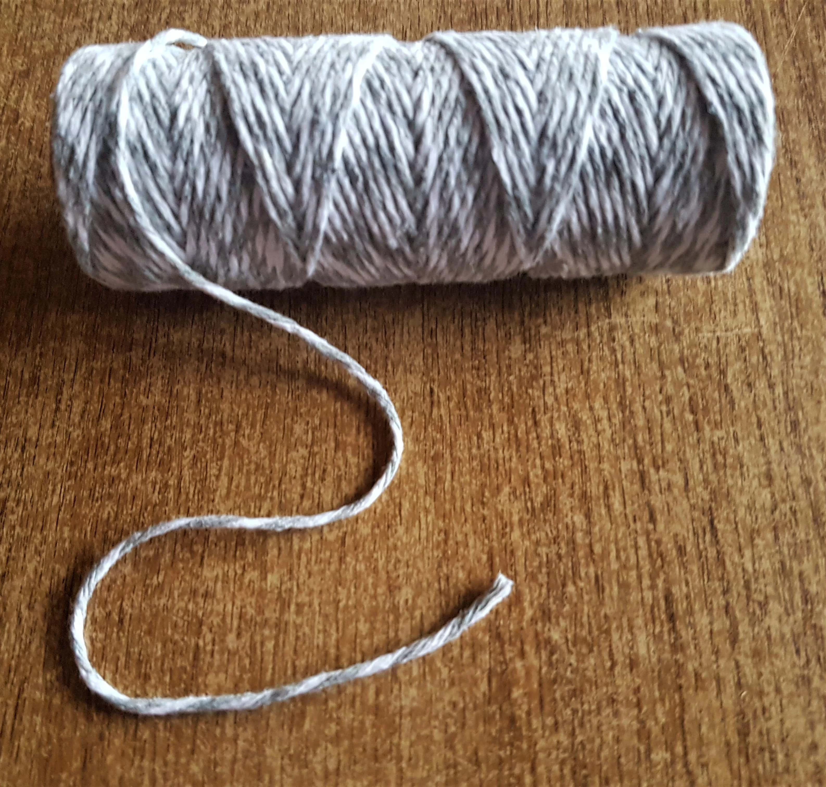 Roll of Grey and White String.
