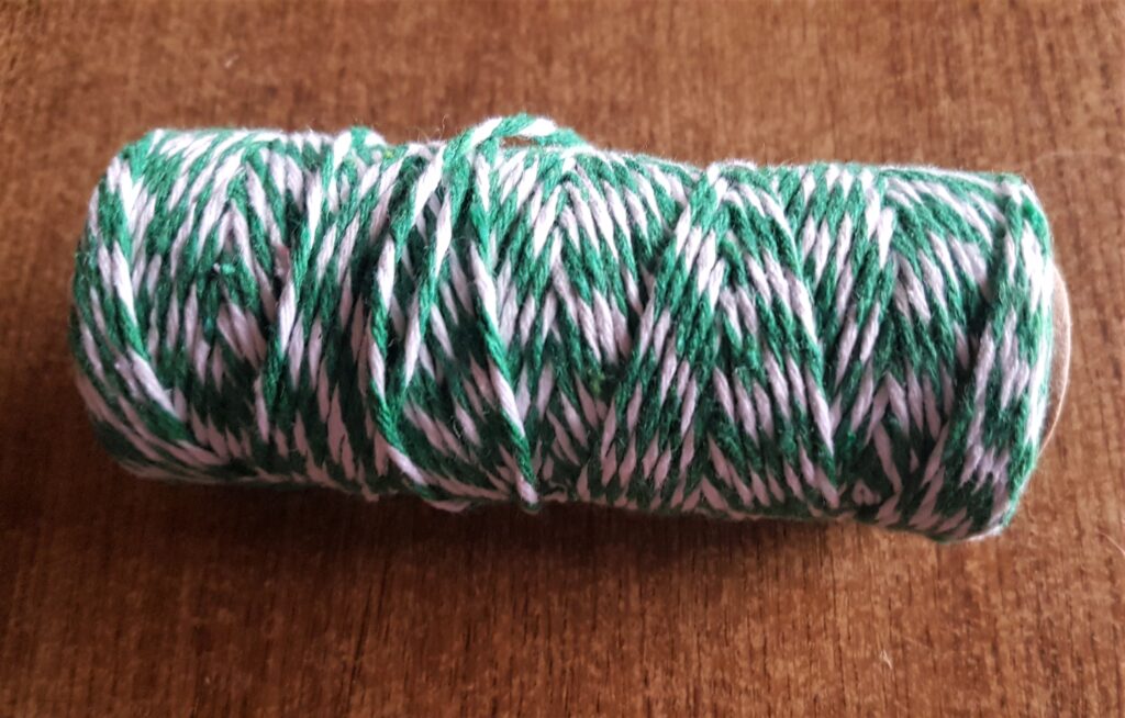 Roll of Green and White String.