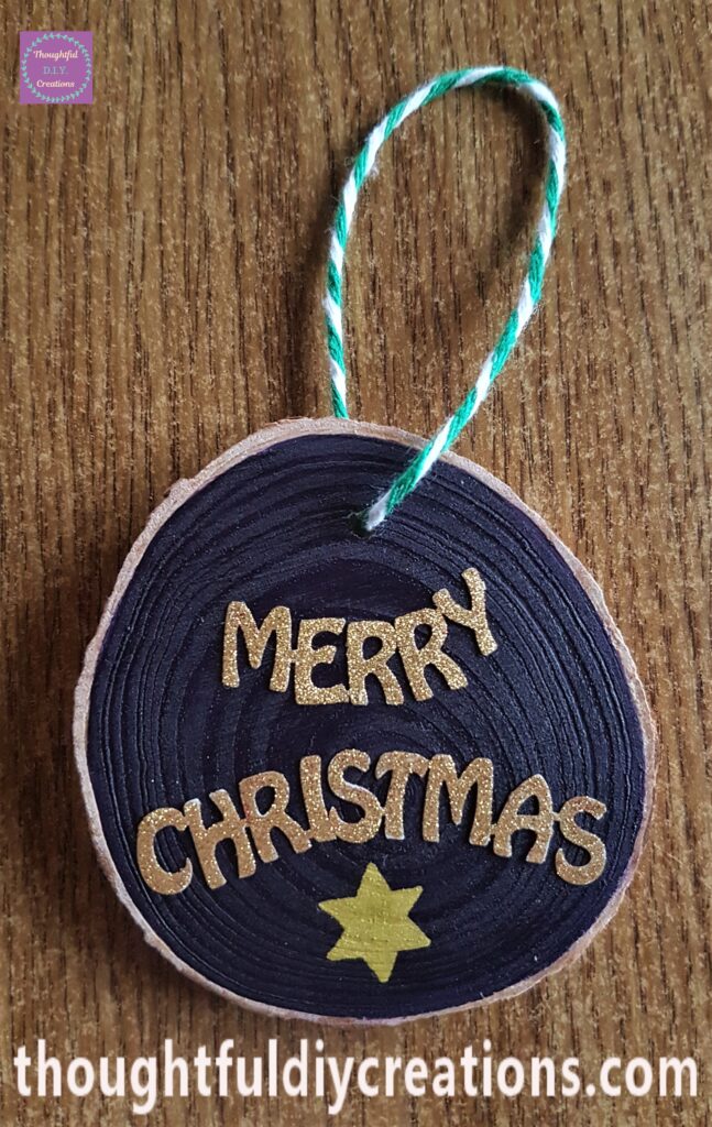 I attached the string to complete the merry christmas ornament.