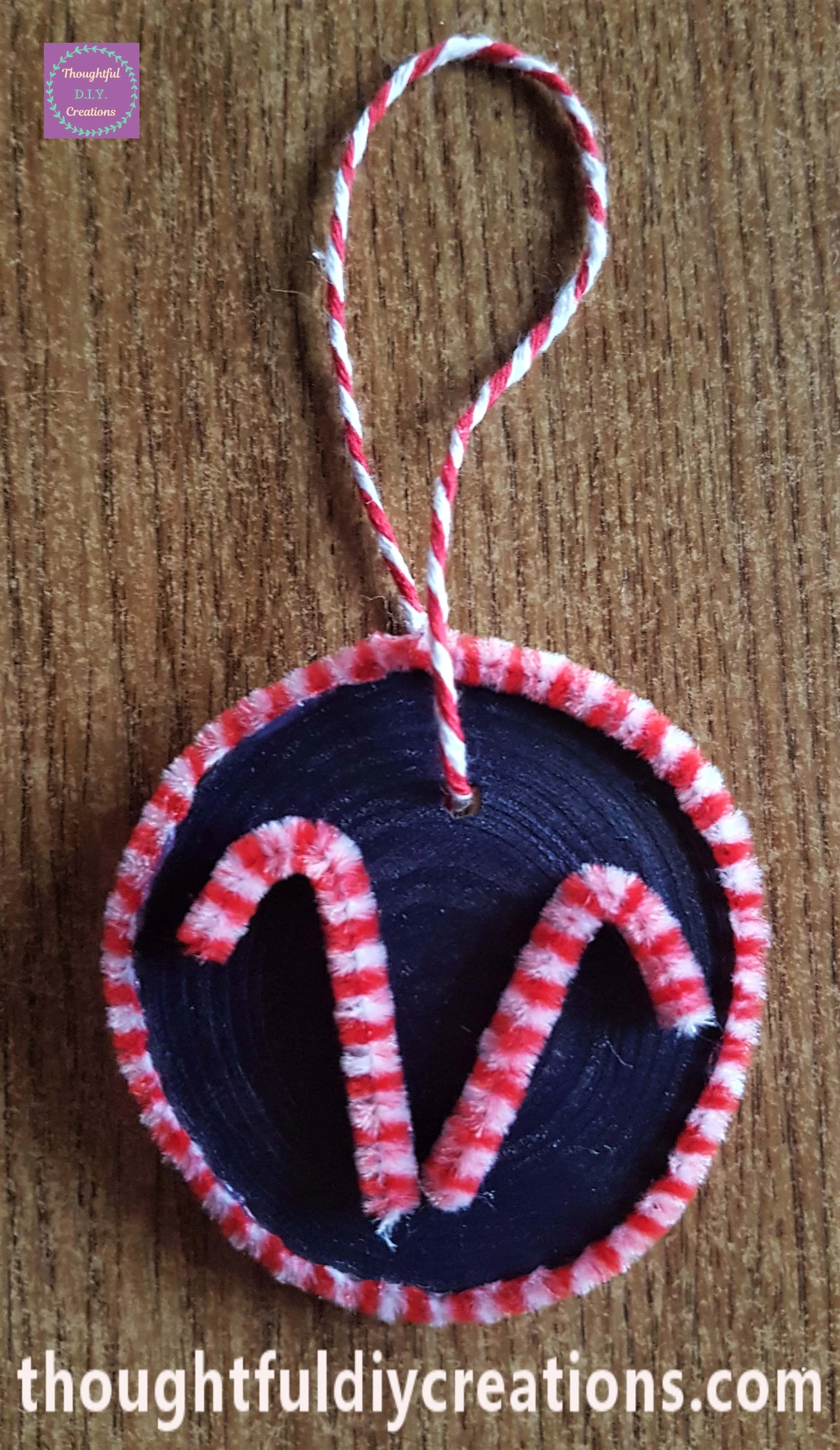 I put it through the hole, tied it and cut the excess string.