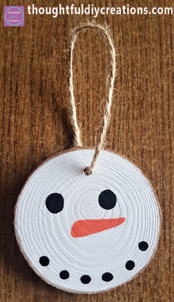 I put it through the hole, tied it in a knot and cut the excess string.