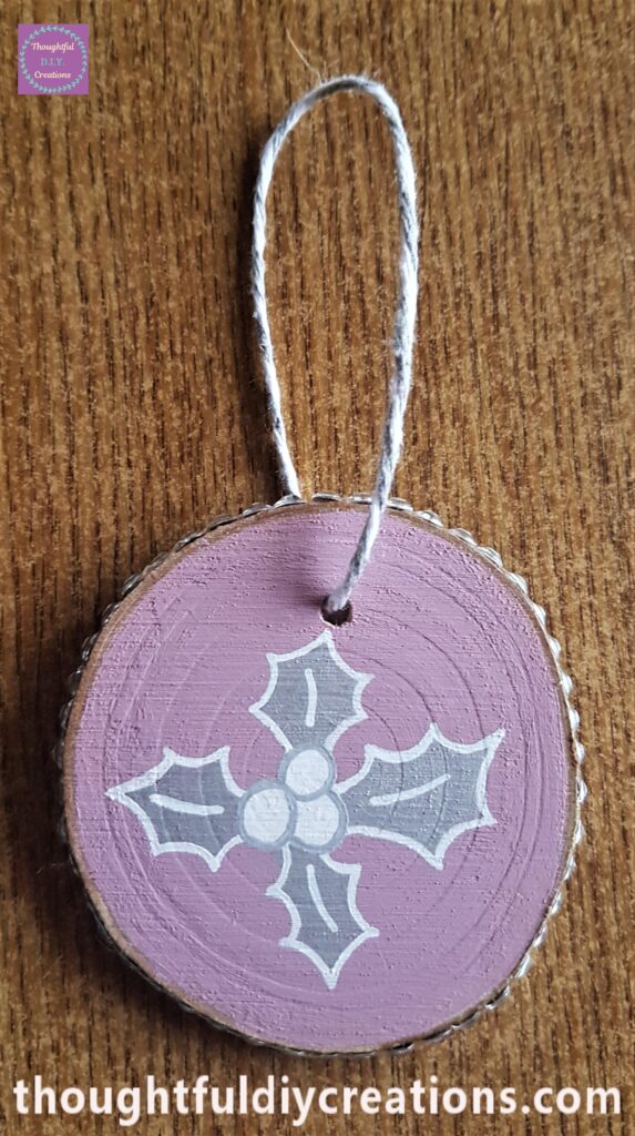 I looped it through the hole, knotted it and cut the excess string.