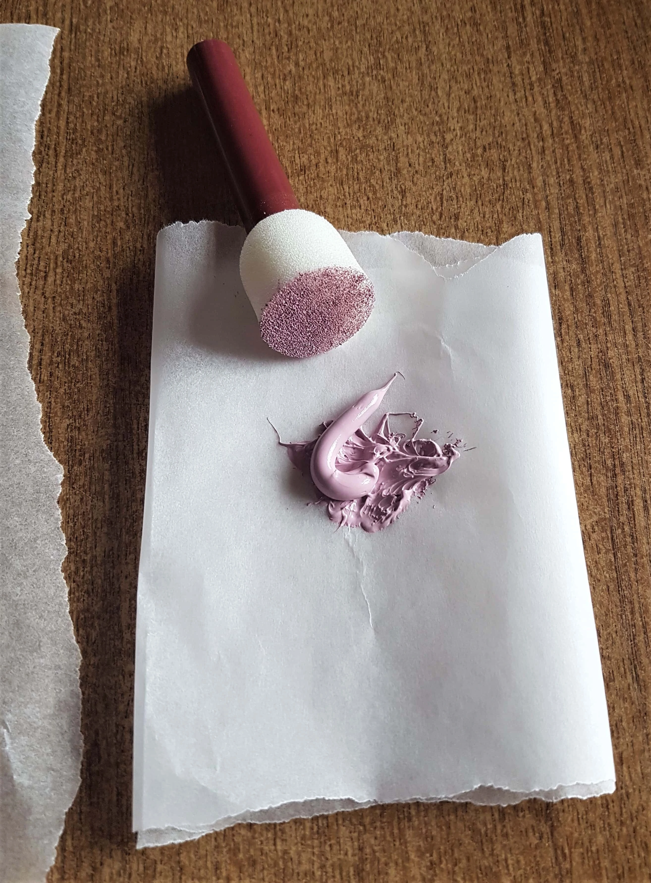 Smaller section of Baking Paper, poured some Paint onto it, dabbed the sponge into the Paint.