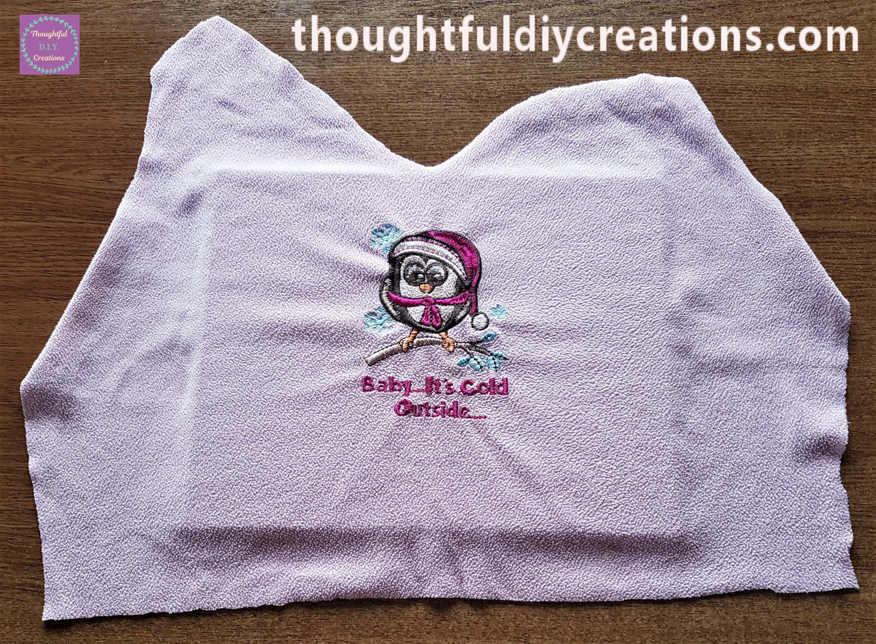 Cut out fabric on top of the backing board from the frame.