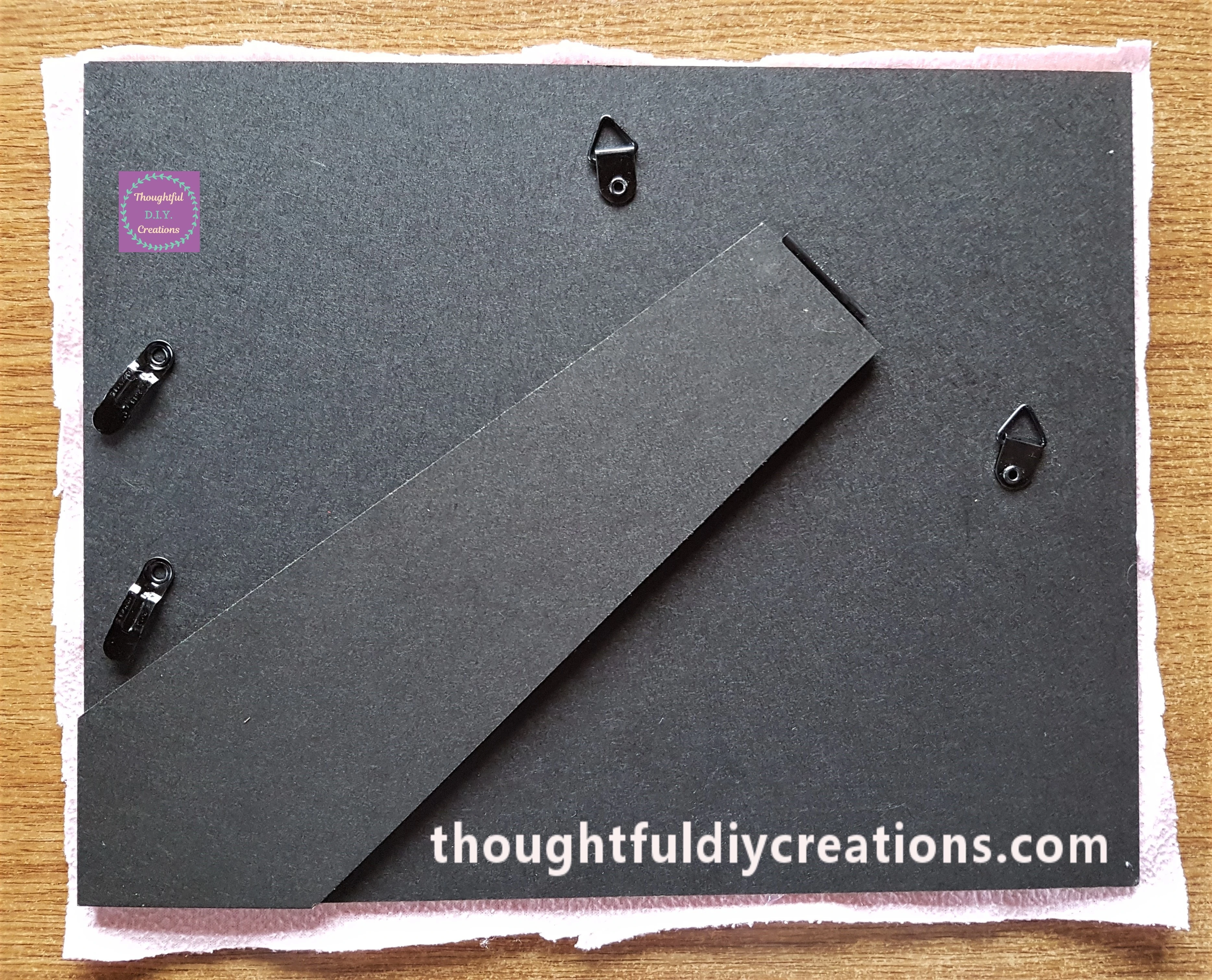 The back of the Christmas Frame with the Fabric attached.