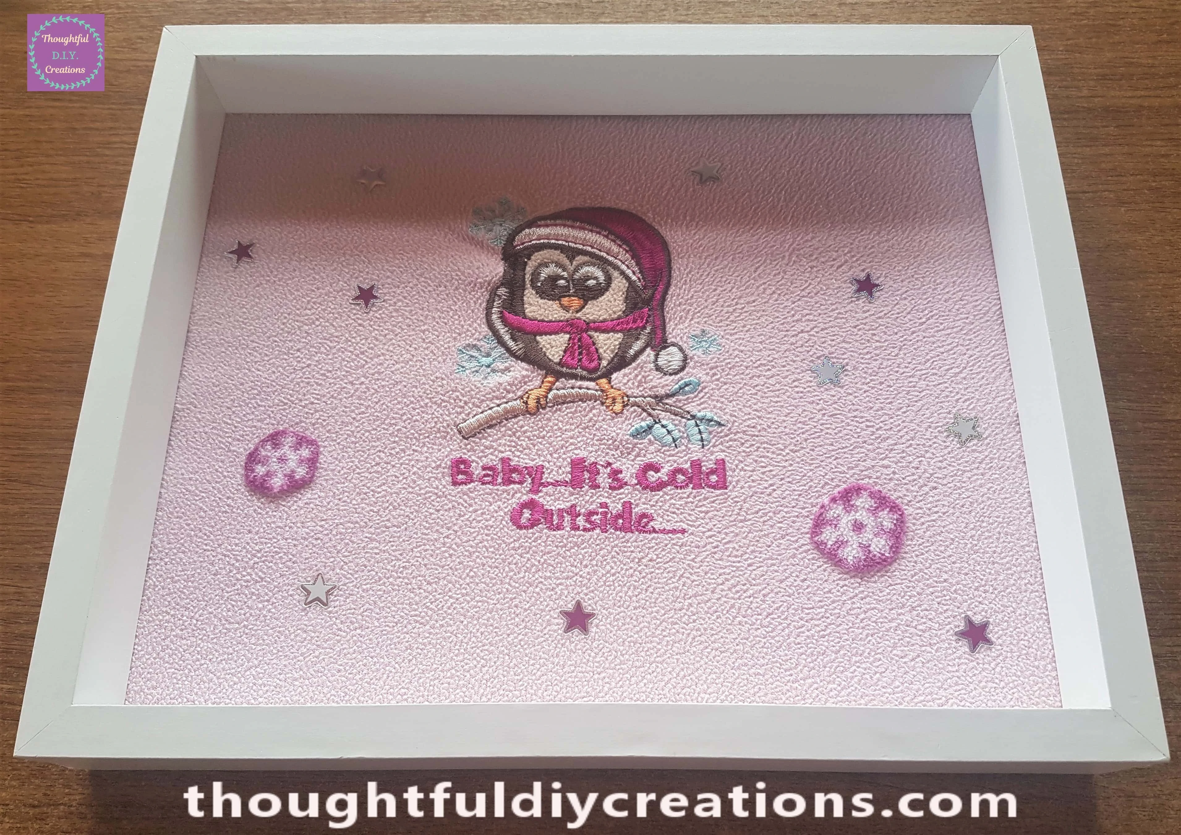 Two Snowflakes attached to the fabric with mod podge and a small paintbrush.