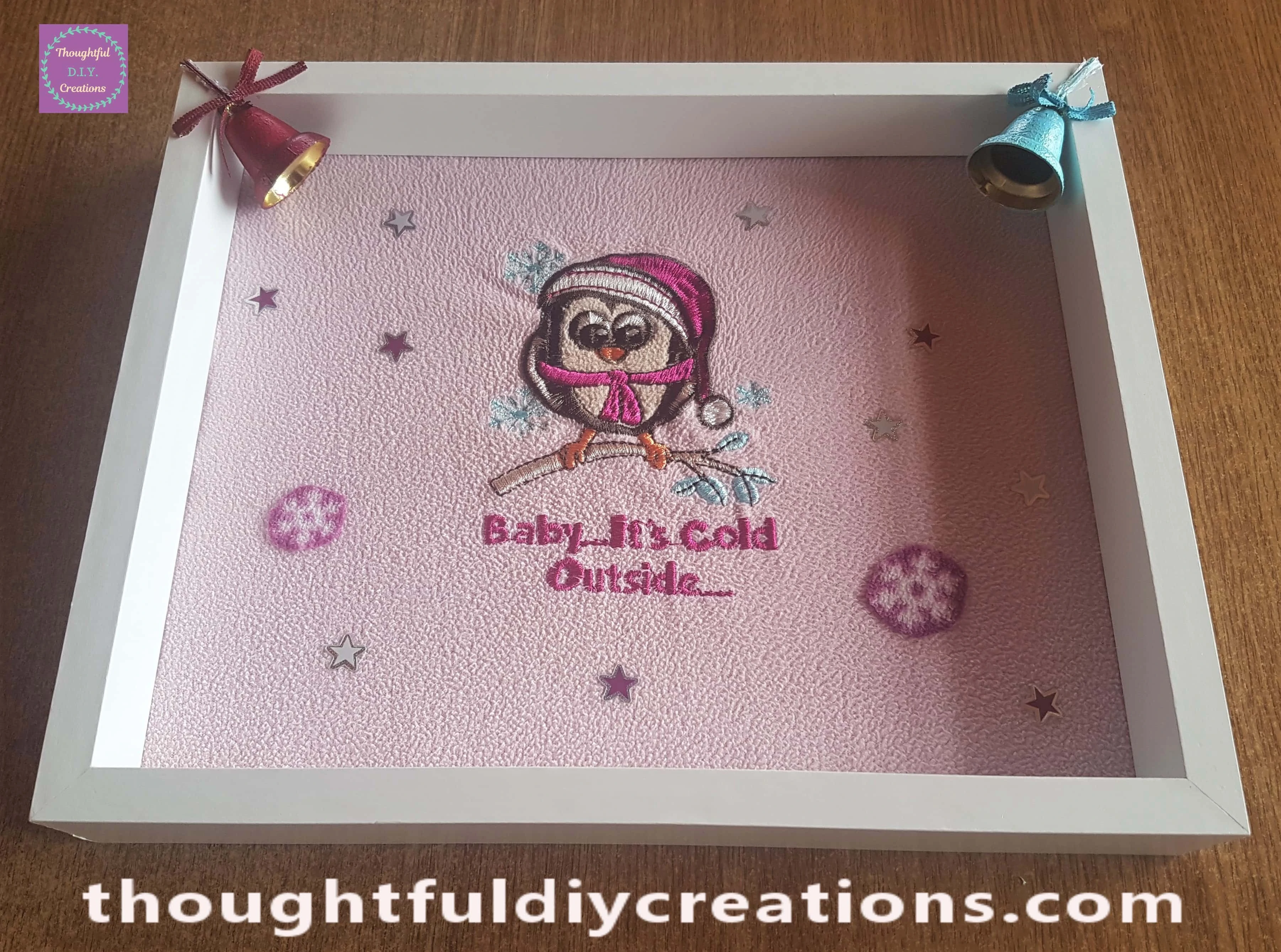 I cut the excess string from the bells. The Christmas Frame with the bells attached.