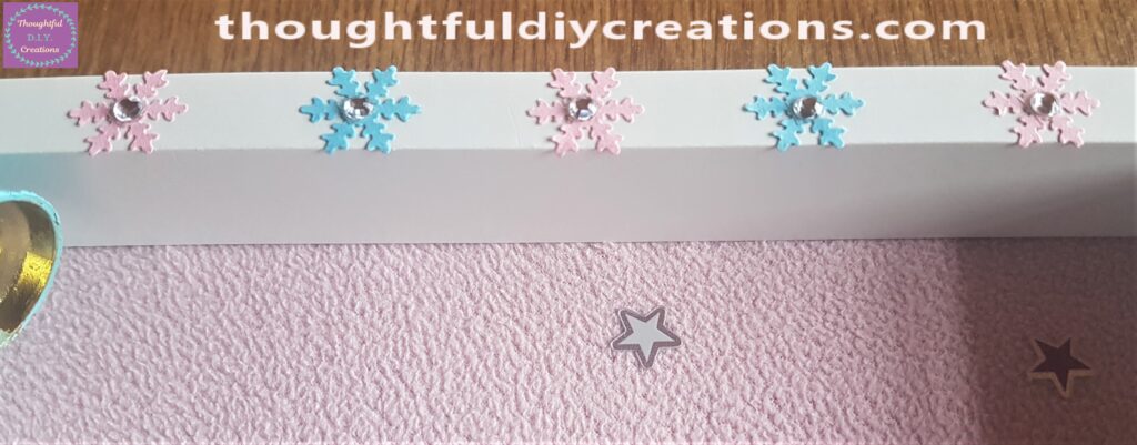 I added a clear gemstone sticker to the center of each snowflake.