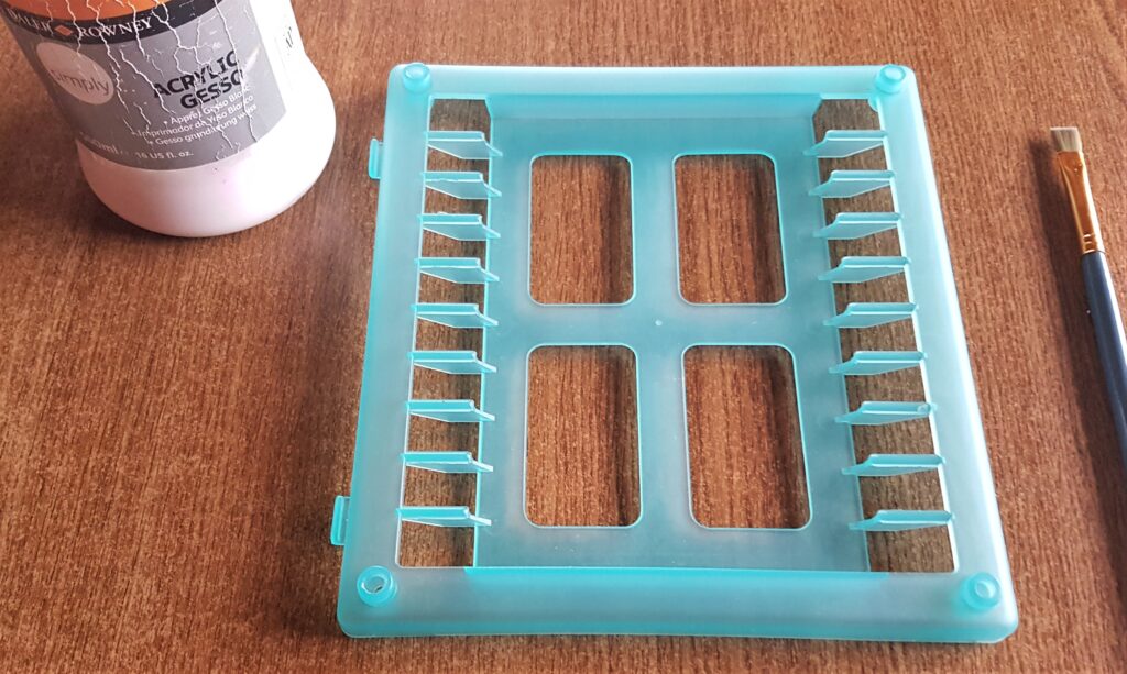 White Acrylic Gesso and a small flat paintbrush to prime the CD holder.