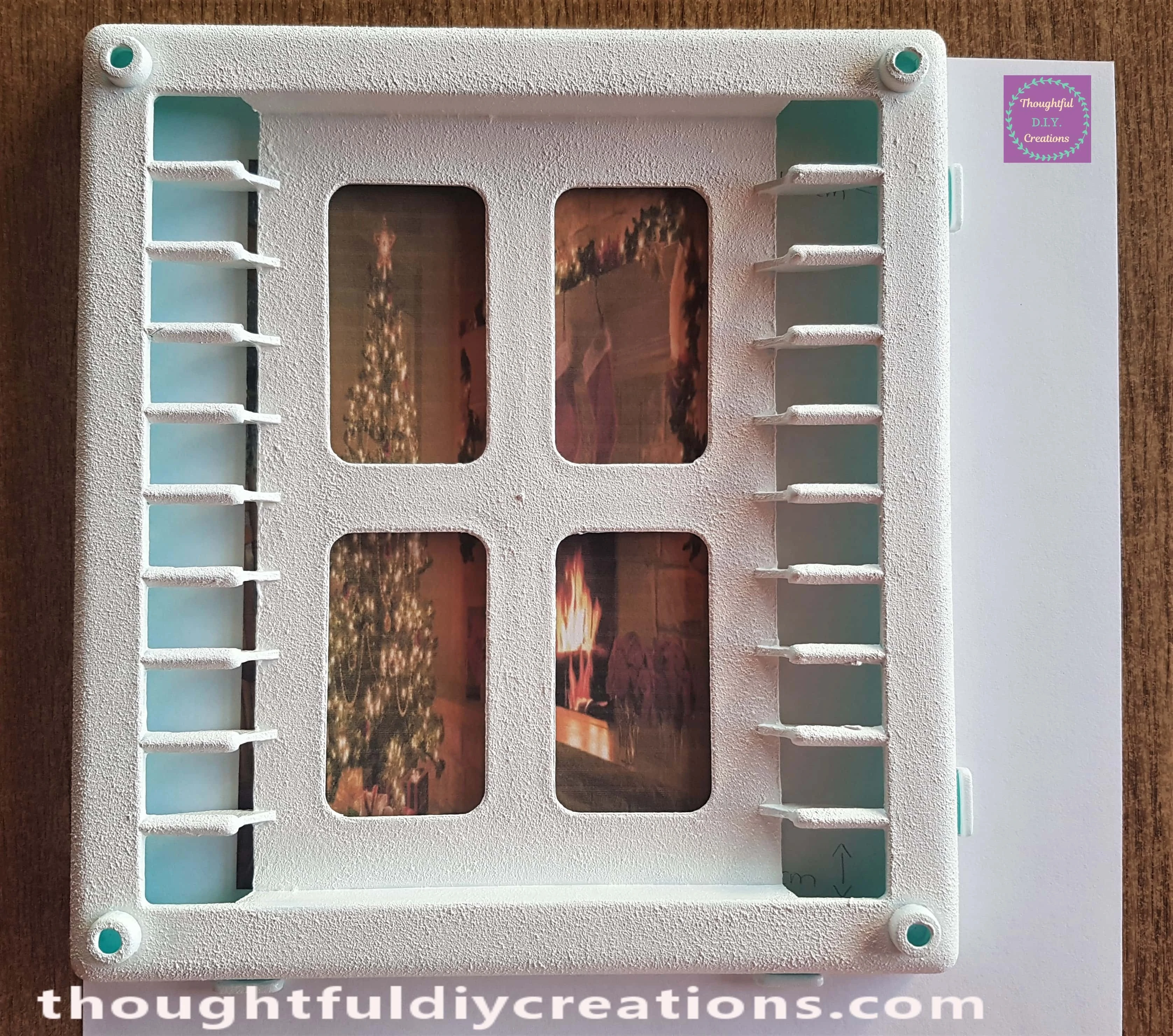 I put the Image under the CD holder to mark where to cut. I didn't want the window to be seen just the Tree and Fireplace.