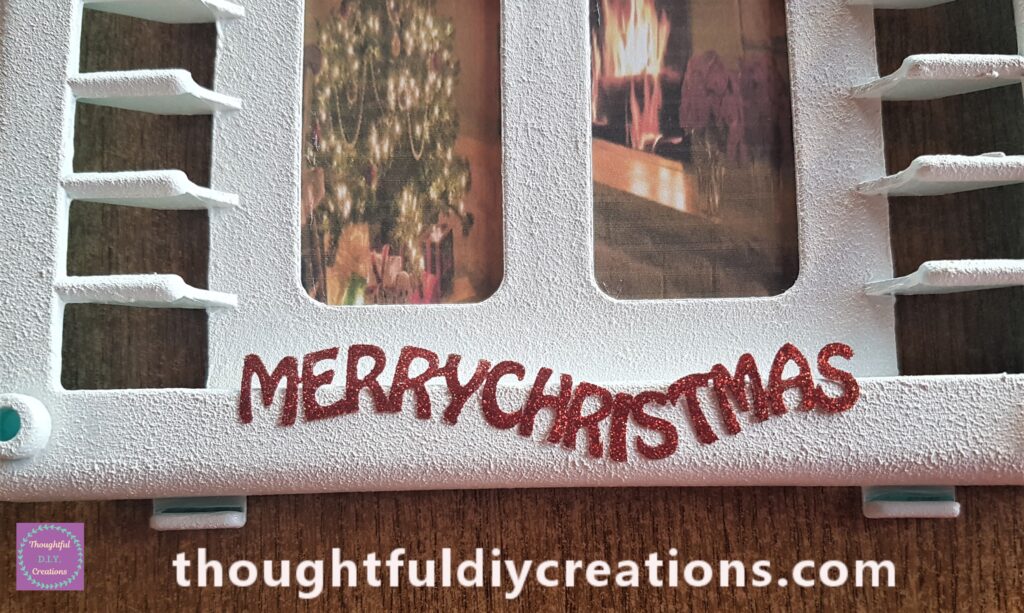 I removed a red sticker and attached it to the bottom of the Christmas Window.