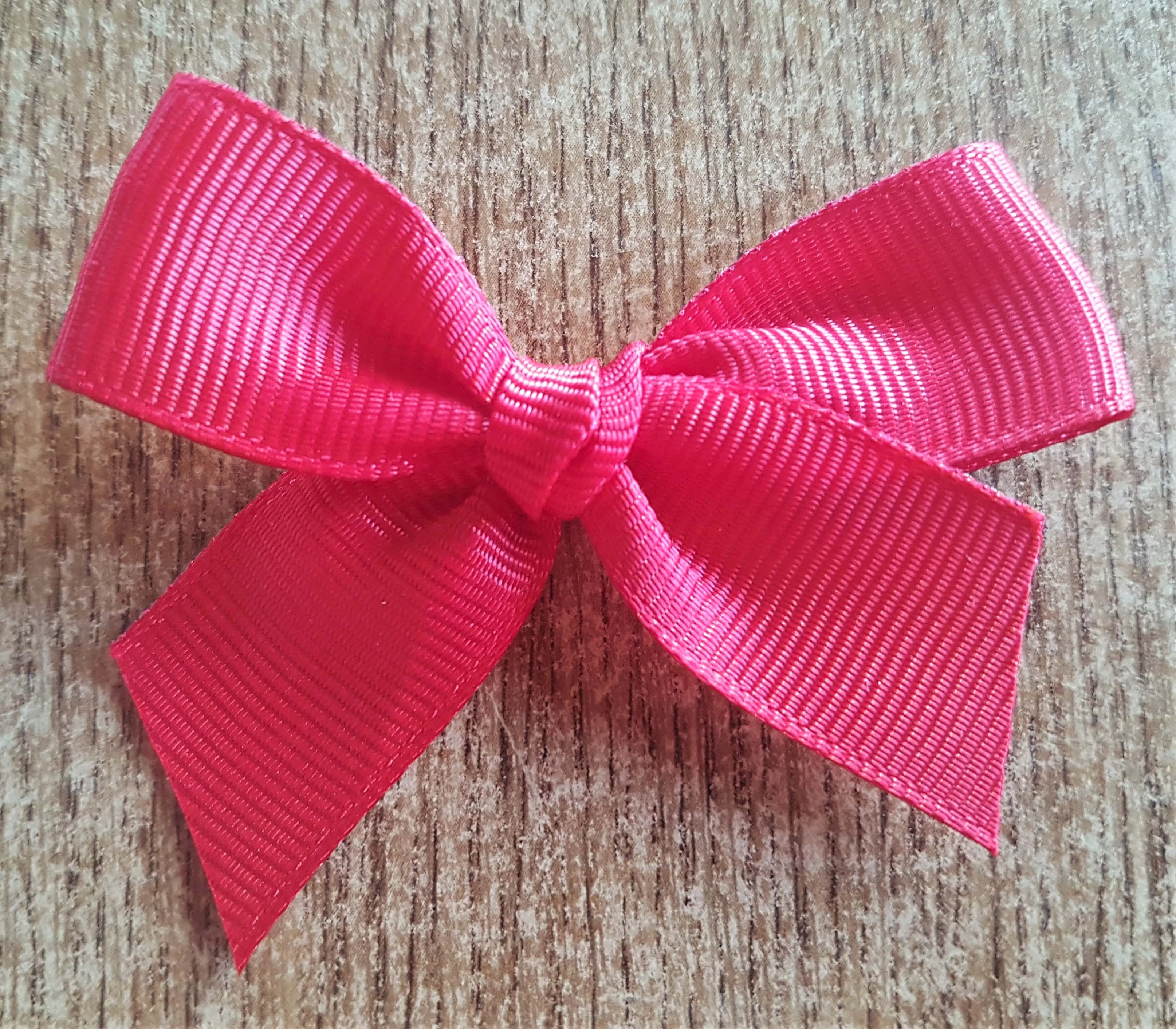 I removed the Bow from the outer ribbon and cut the bottom strings shorter to fit the window.