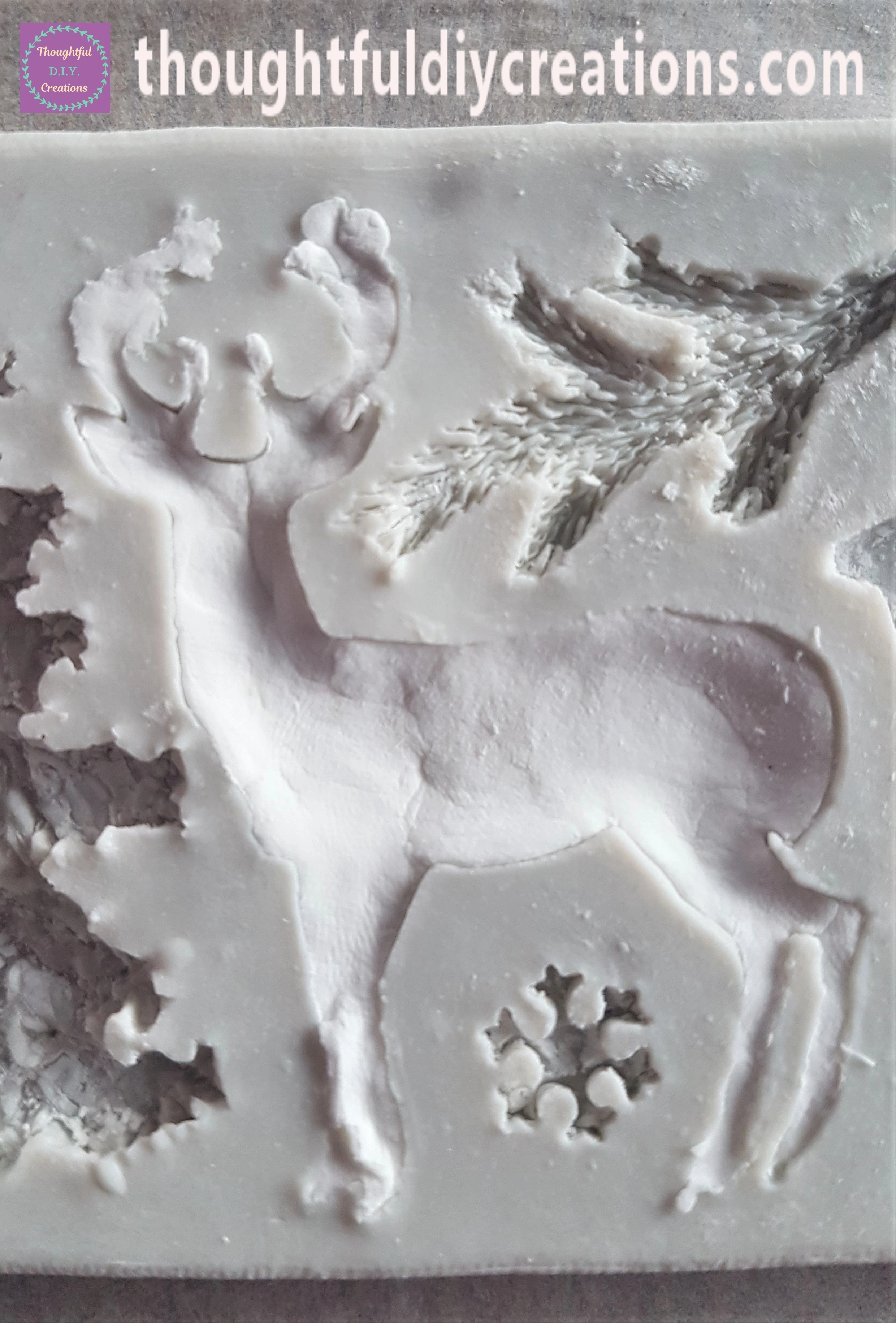 I got a small amount of Clay and softened it in my Hands. I pushed it into the Mould, I then got some more Clay and repeated the process until the Deer Mould was full of Clay.