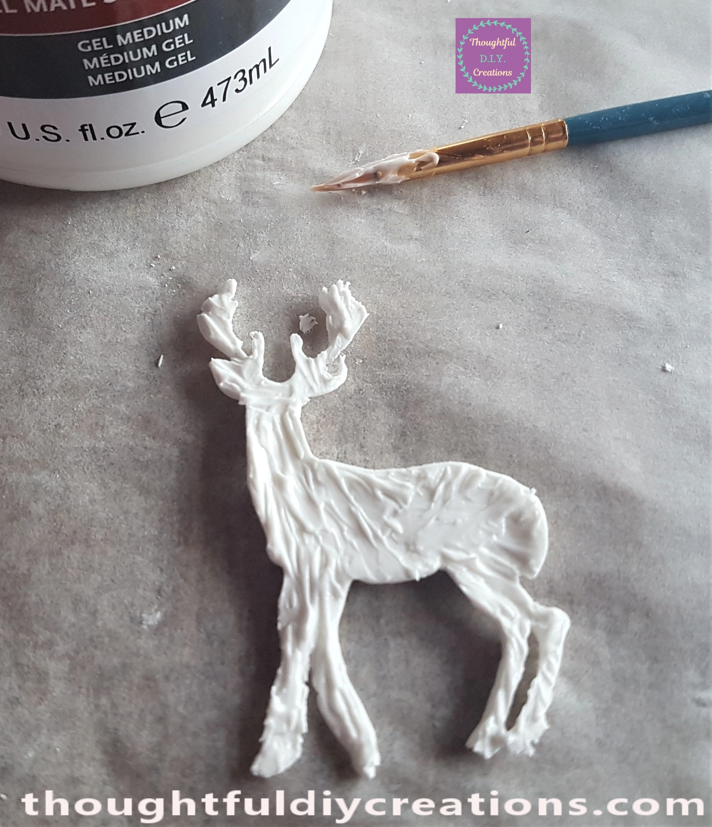 Matte Super Heavy Gel Medium on the back of the Deer Mould with a small Paintbrush.