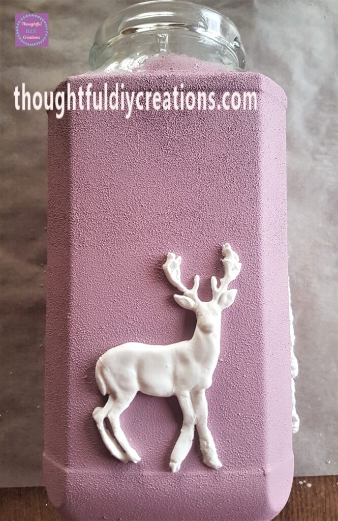 I attached the first of the Christmas Clay Moulds to the Jar.