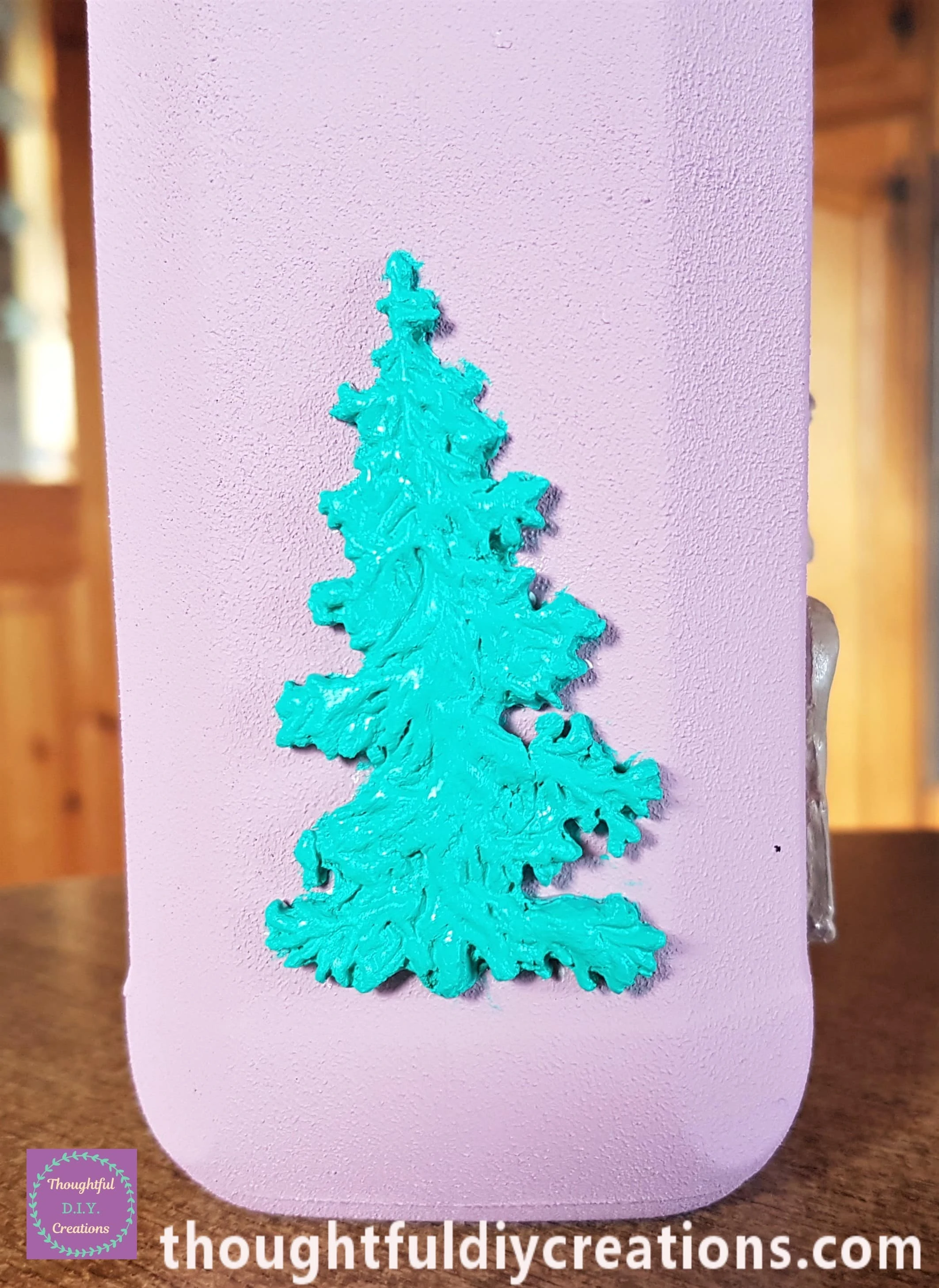 I mixed White Acrylic Paint with Phthalo Green Acrylic Paint and Painted 2 layers onto the Trees on the Jar.