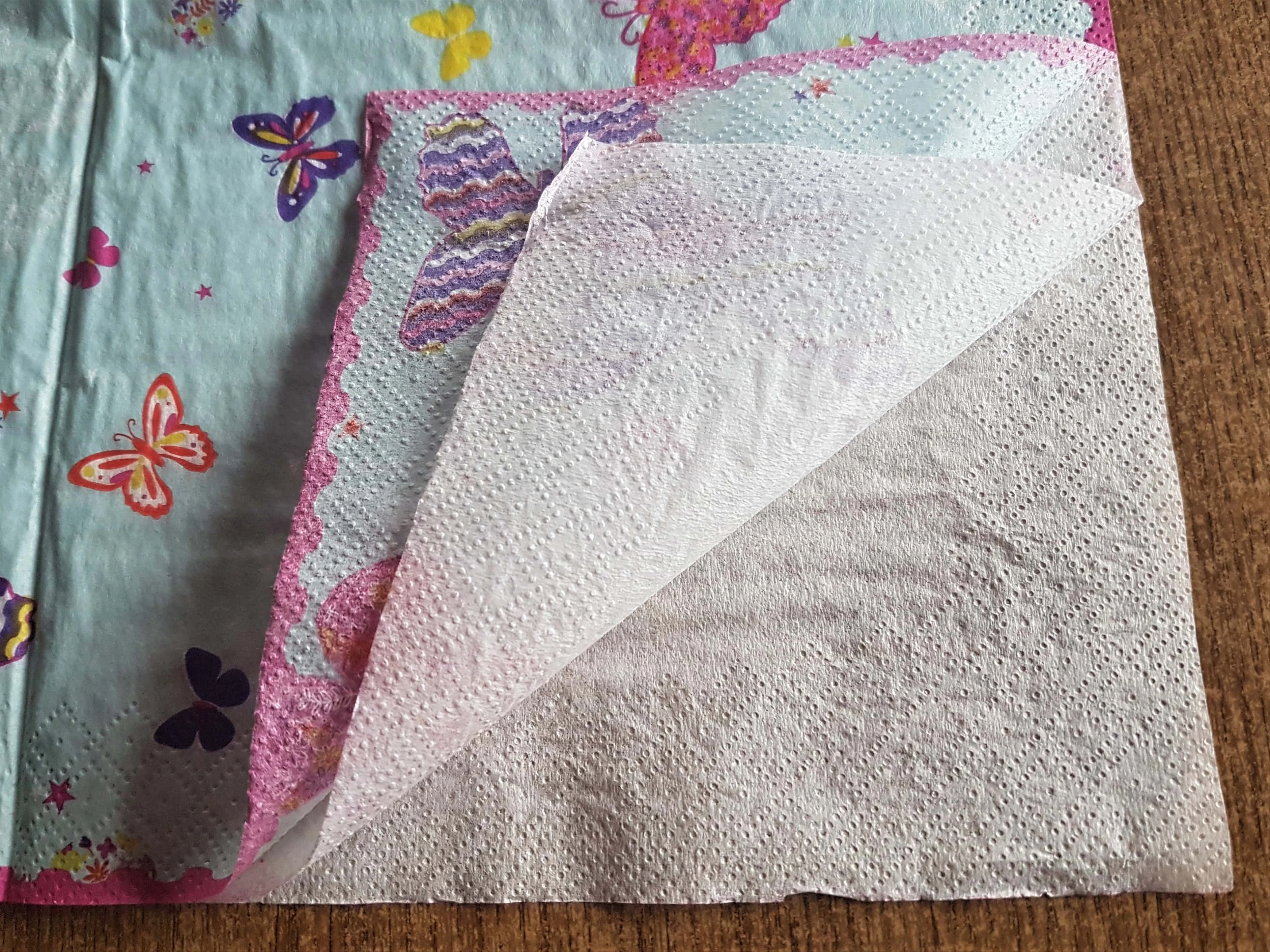 I got 1 corner of the Napkin and carefully began to separate the 2 bottom plain layers from the top patterned napkin.