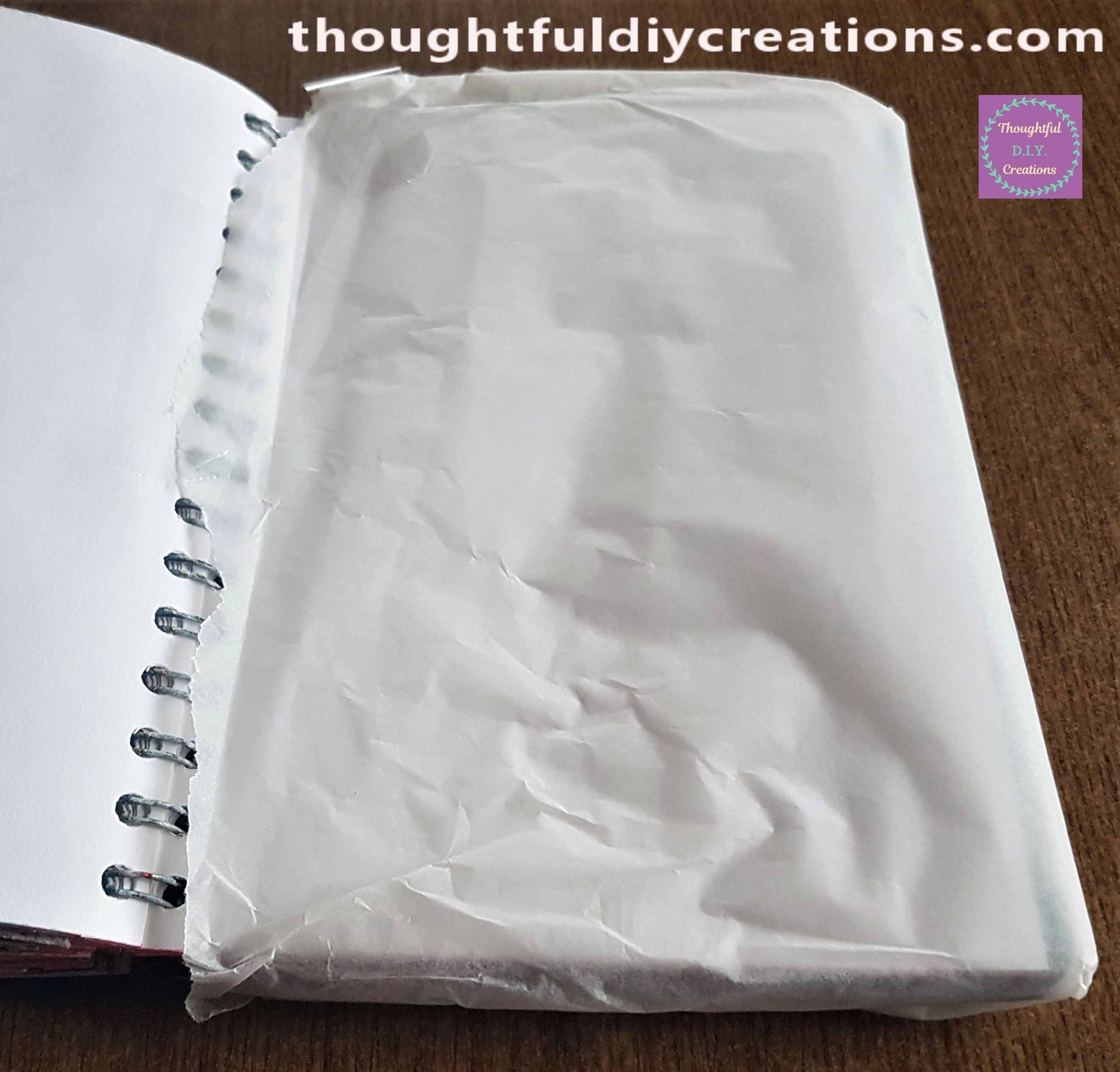 I sellotaped it from the next page to the back of the Journal to prevent any Paint getting on the rest of the Pages.