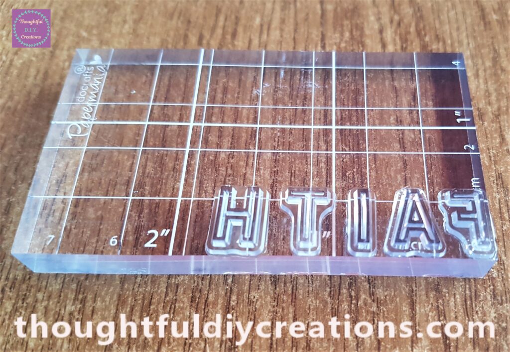 I attached each letter beside each other one-by-one to an Acrylic Block.