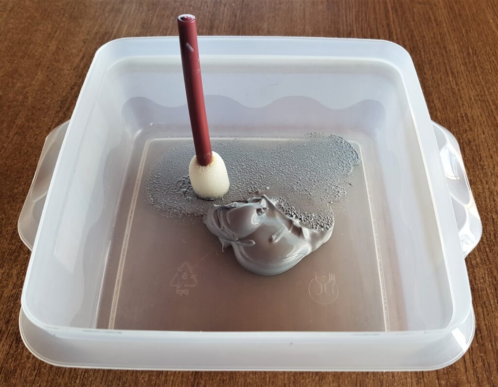 I dabbed the smaller Sponge into the Paint and tapped the excess into the Container.