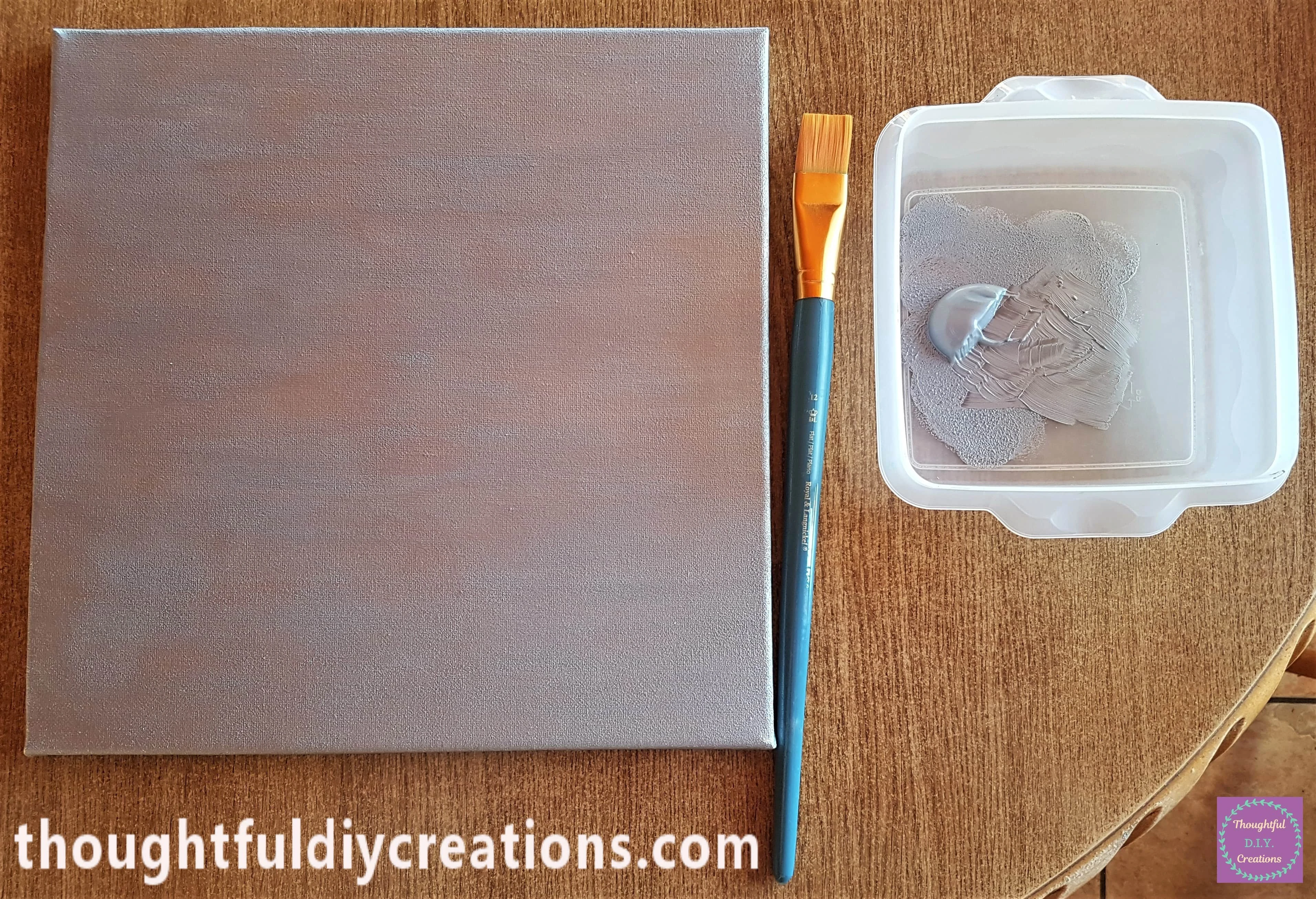 I Painted the second layer of Paint onto the Canvas with a Flat Paintbrush. It was now nice and smooth.