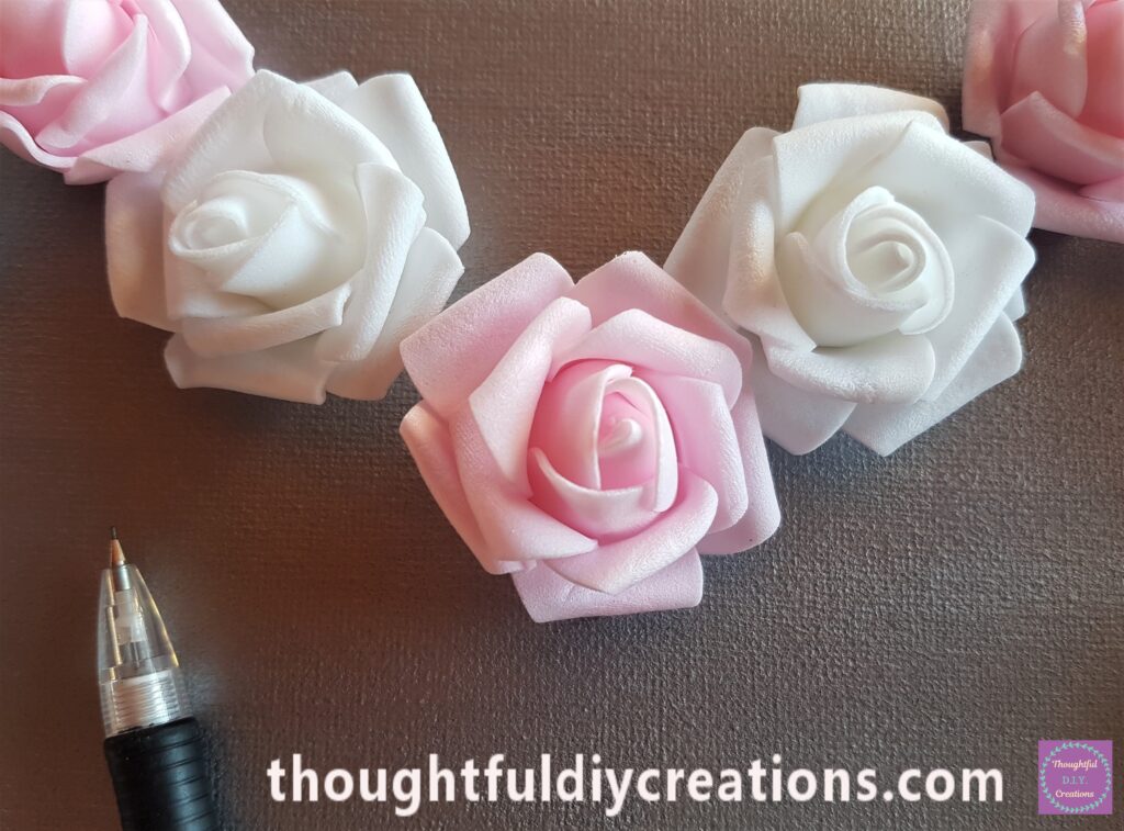 I got a Pencil and made a mark on the Canvas at the Top and Bottom of the Rose.