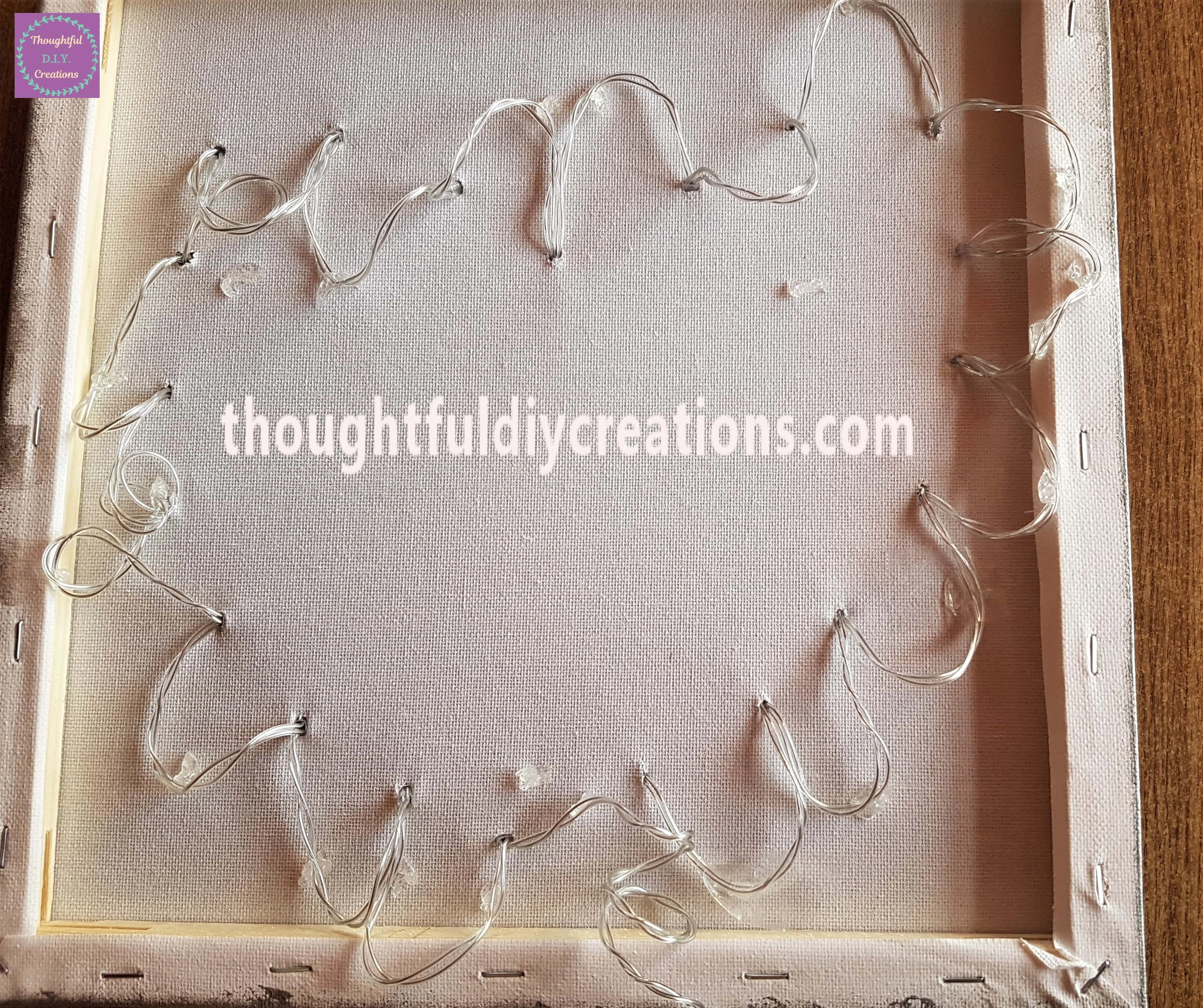 I attached the String from the Lights to the Glue Dots to hold them down and keep them in place.