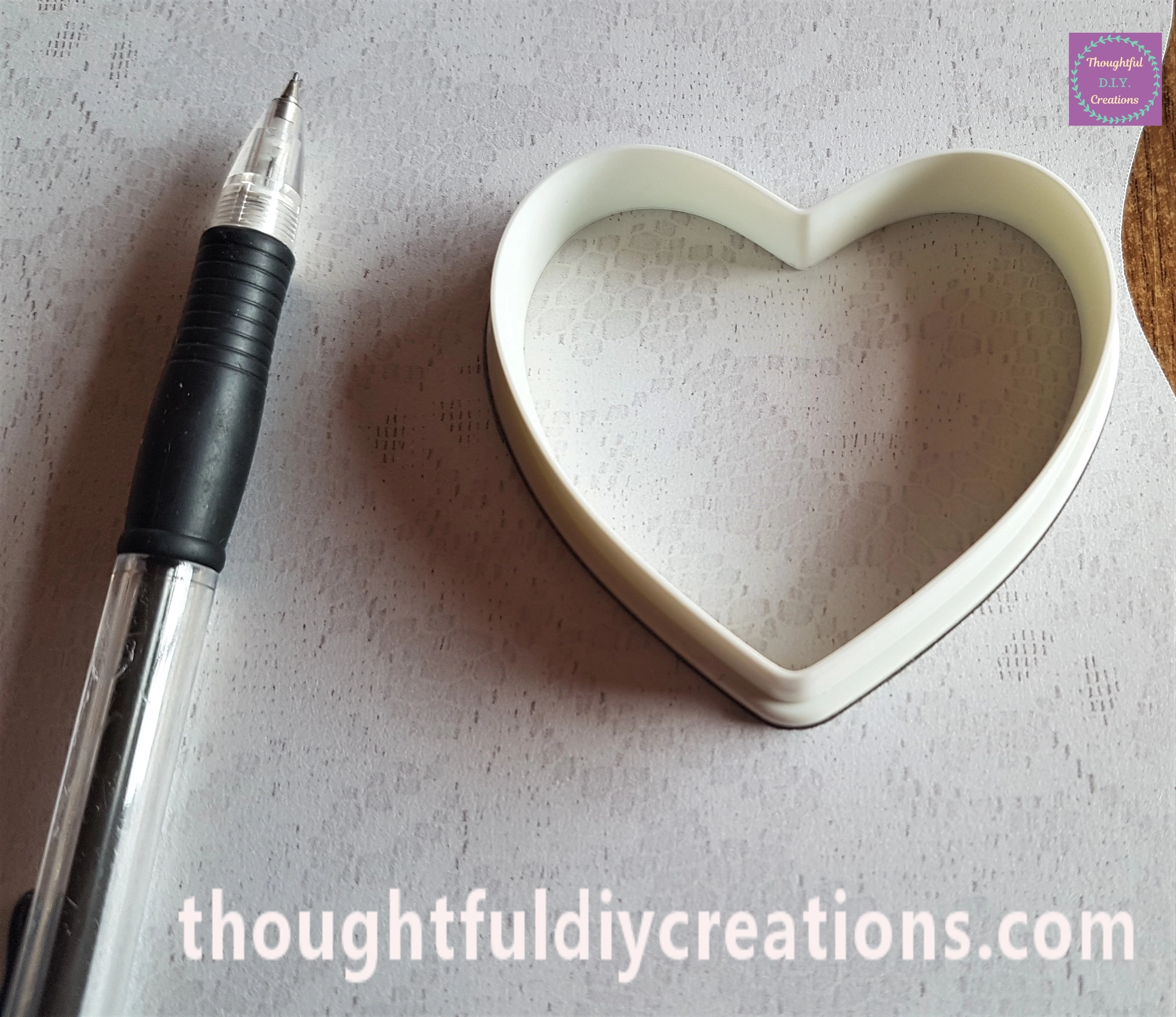 I traced around the Heart Shape with a Pencil onto Lace Patterned Paper.