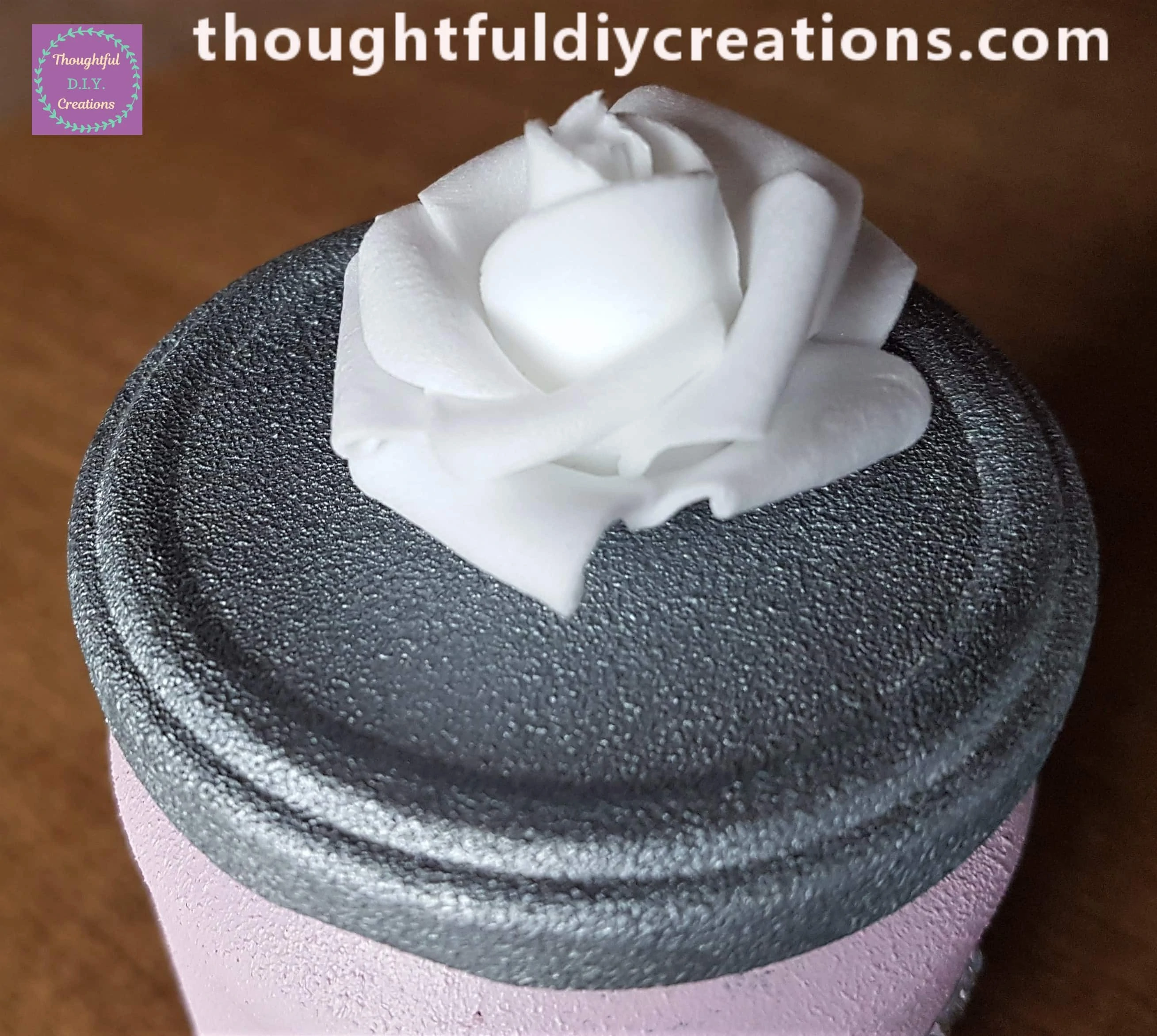 I attached it to the center of the Silver Lid with my Hot Glue Gun.