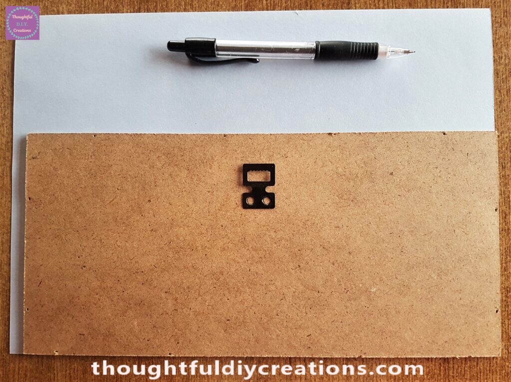 I put the Backing of the Frame over the Blue Sheet and traced around it with a Pencil.