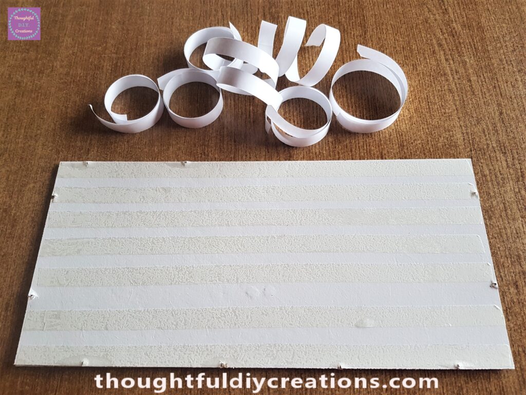 I removed the white backing of the Double-Sided Tape. The Tape is clear and sticky on both sides.