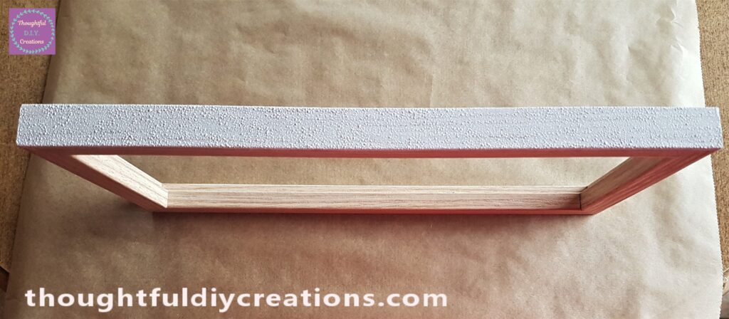 Frame standing up on the Baking Paper. I dabbed the sponge with paint onto the flat part of the Frame.