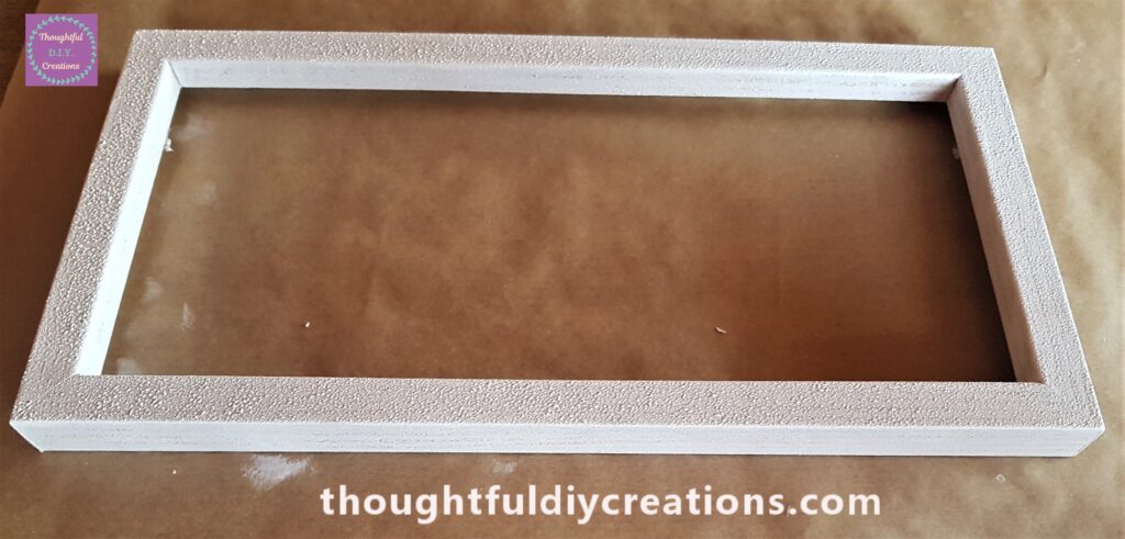 I painted the top of the frame with the sponge. It had one even coat of paint.