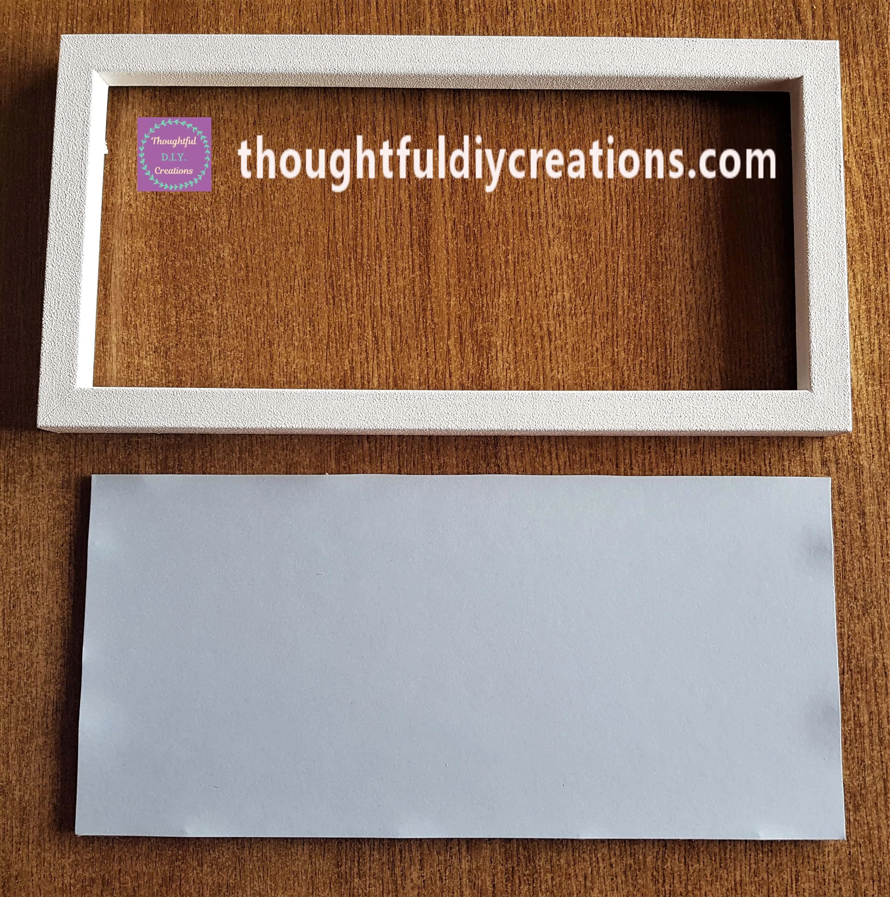 Painted Frame with the Blue Sheet attached to the backing of the Frame.