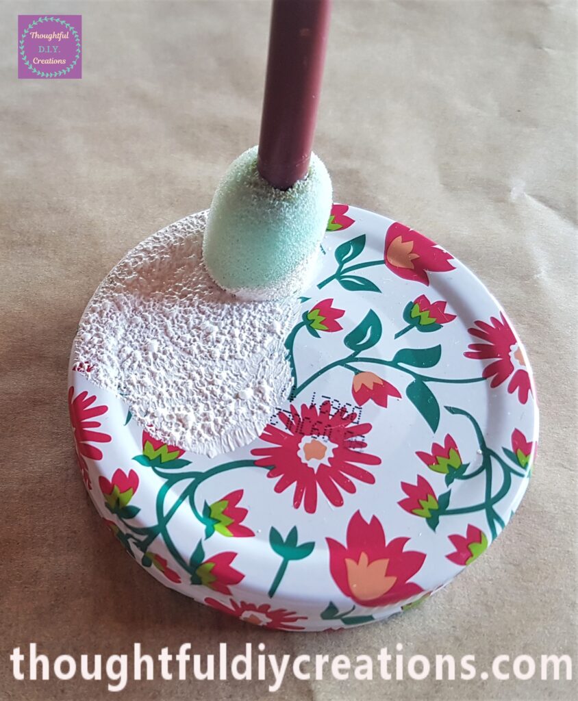 I dabbed the sponge with gesso onto the front flat side of the lid.