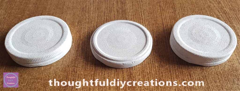 The Lids after the second coat of Primer had been applied and dried.