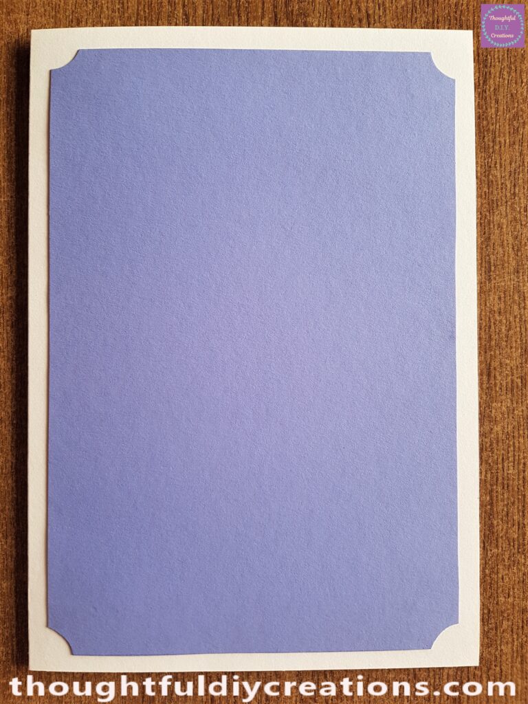 I put Pritt Stick all over the back of the Purple Sheet and attached it to the Cream Card.