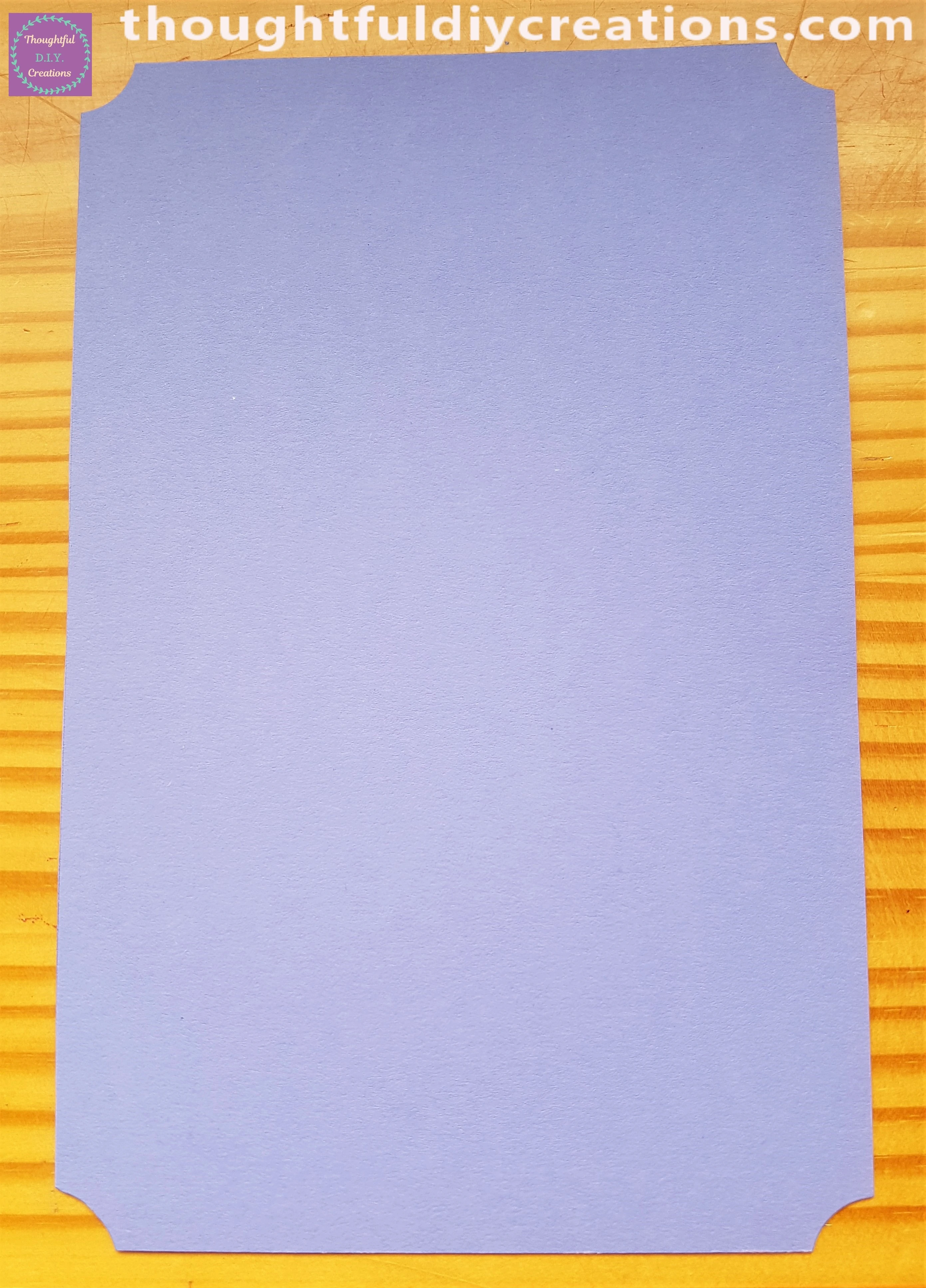 I cut out a section of Purple Cardstock. I also removed the 4 corners with my Corner Punch.