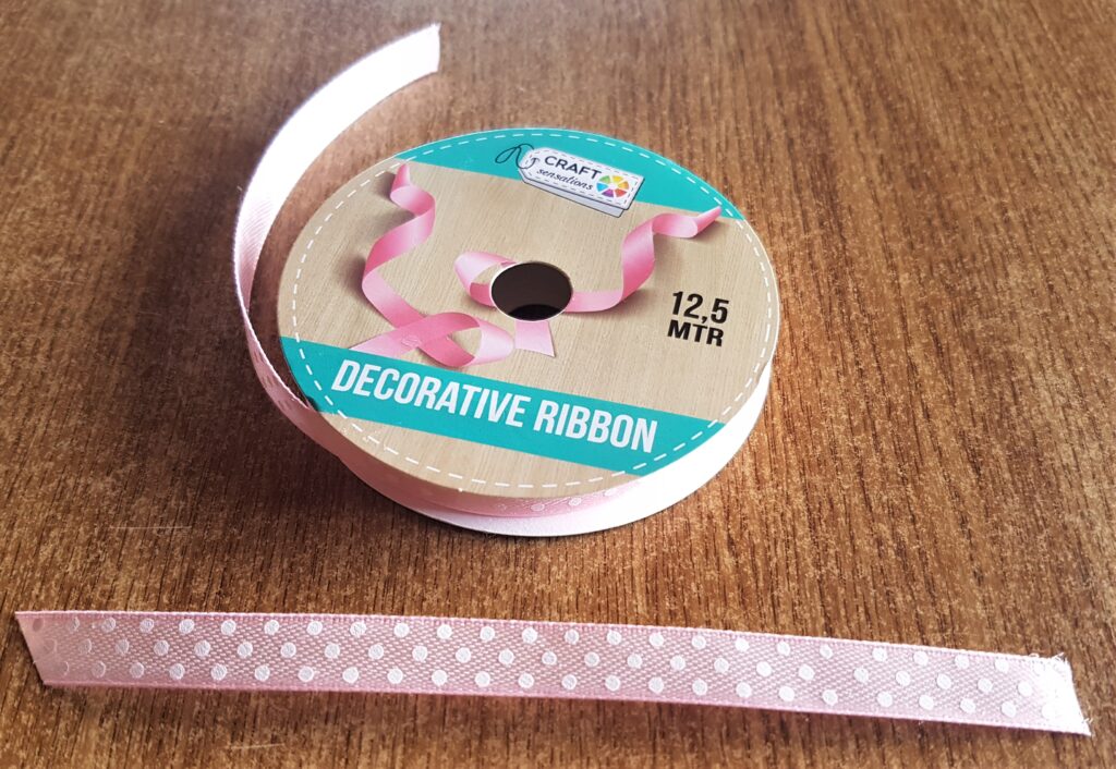 I cut off a piece of pink and white polka dot ribbon.