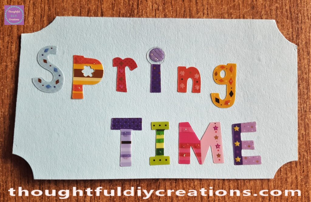 I added the Stickers to Spell 'Spring Time' to the Blue Cardstock.