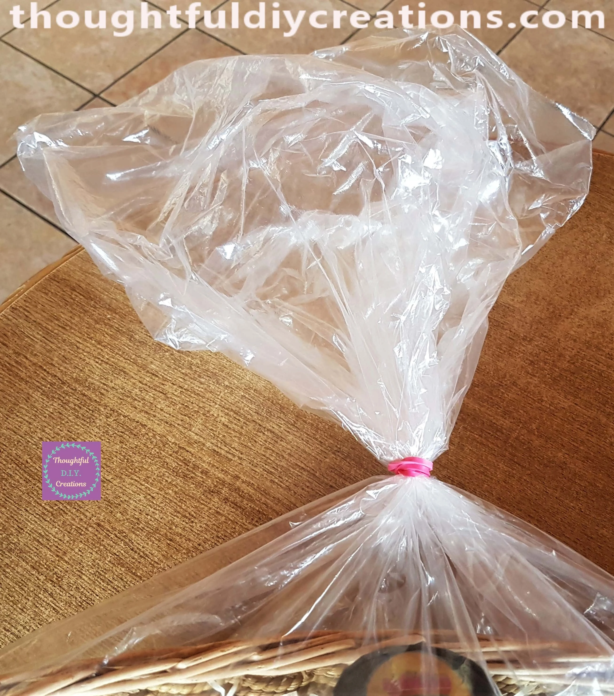 I tied the top of the plastic cover with a Pink elastic Band.